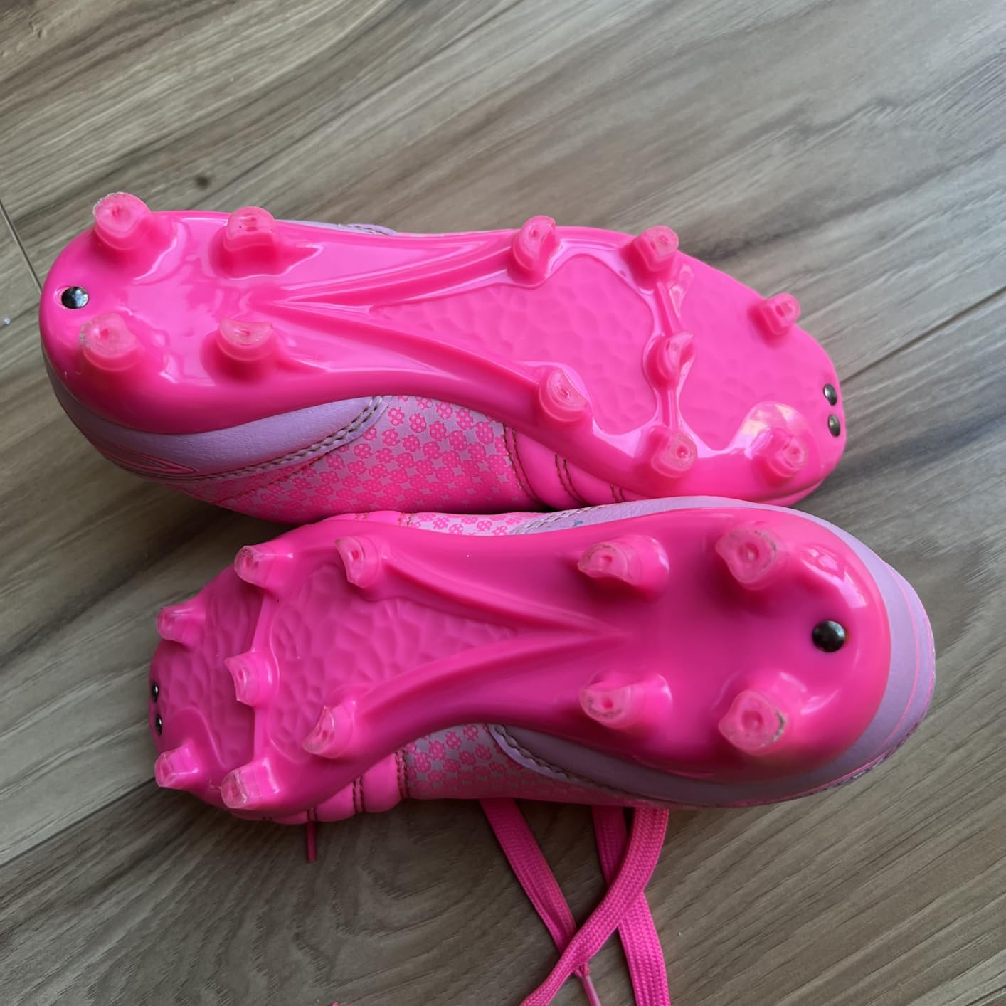 Comparison showing DREAM PAIRS cleats wear patterns after extensive use