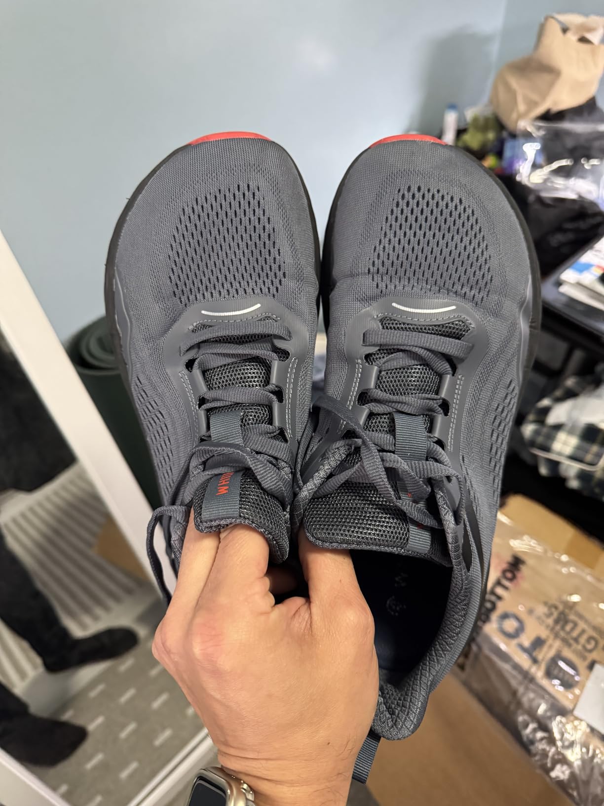 Side view of WHITIN running shoe showing zero drop profile and EVA midsole construction