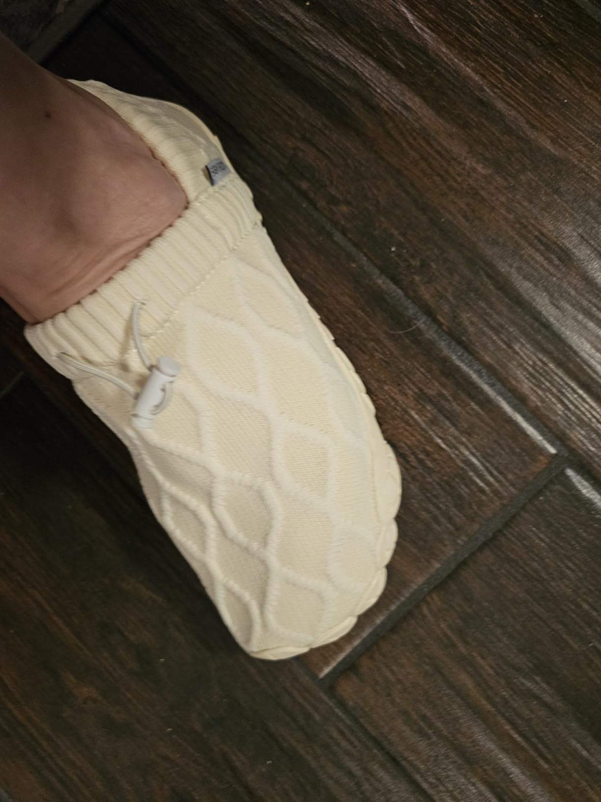 Close-up view of WateLves shoe sole showing anti-slip rubber pattern and textured grip design