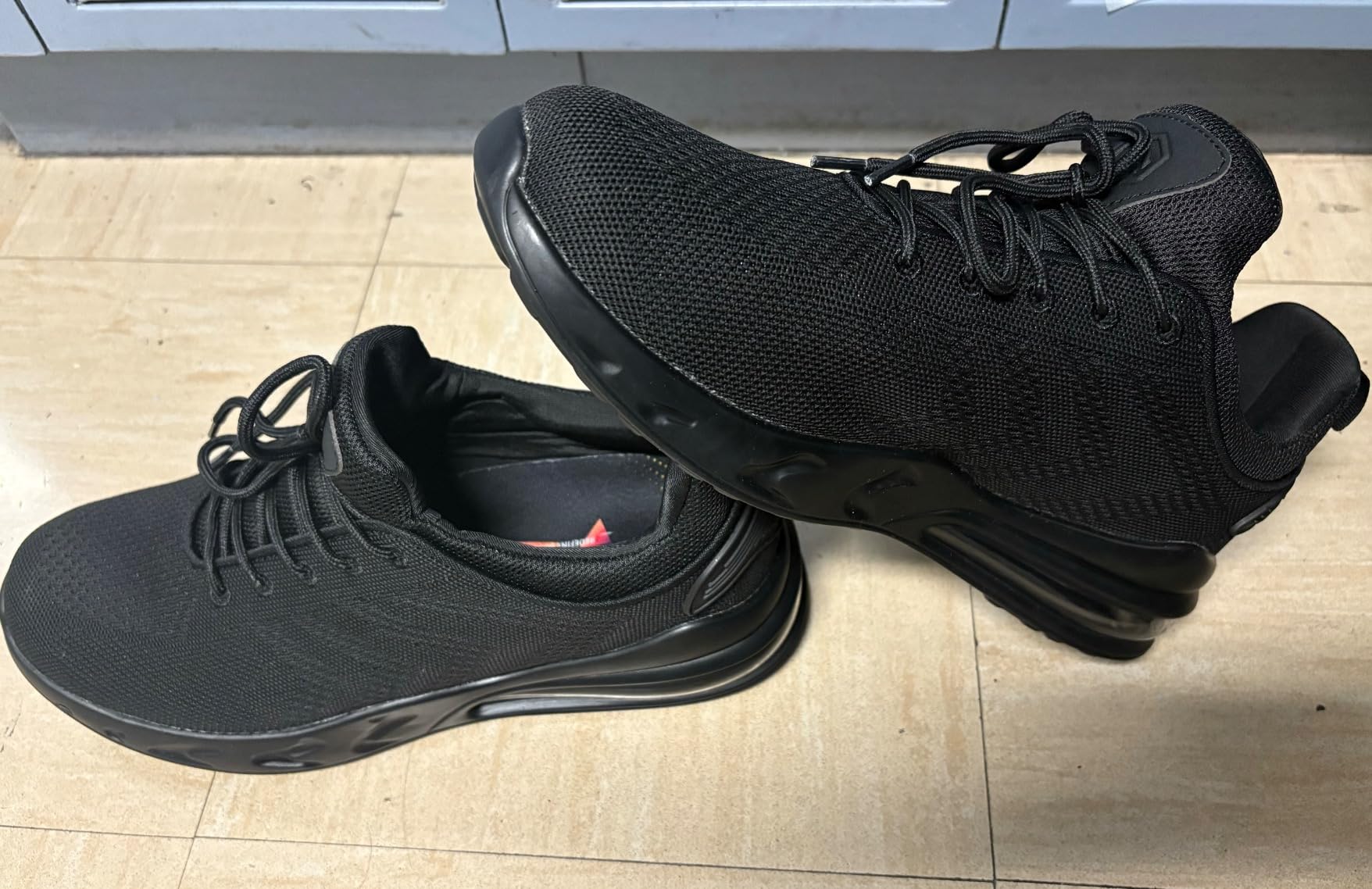 LARNMERN work shoes being tested in kitchen environment showing water resistance
