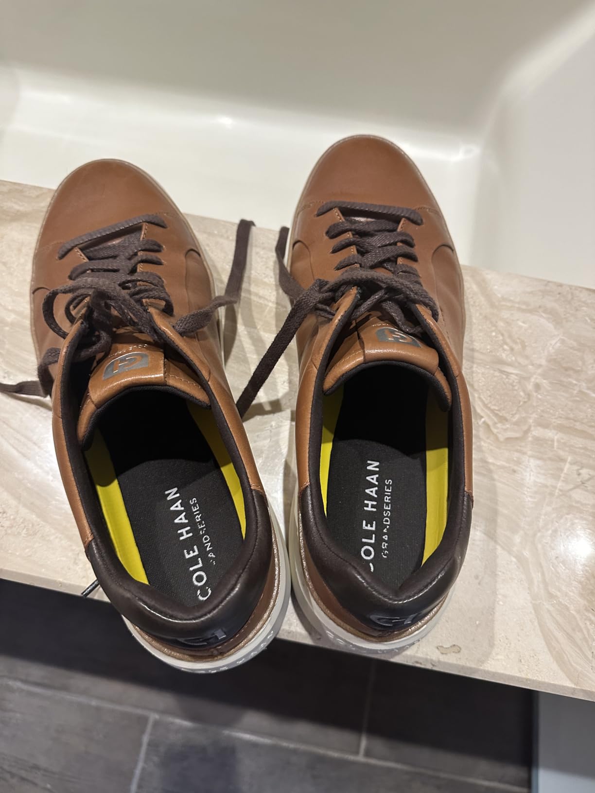Marketing claims verification showing waterproof testing and comfort features of Cole Haan Grandpro