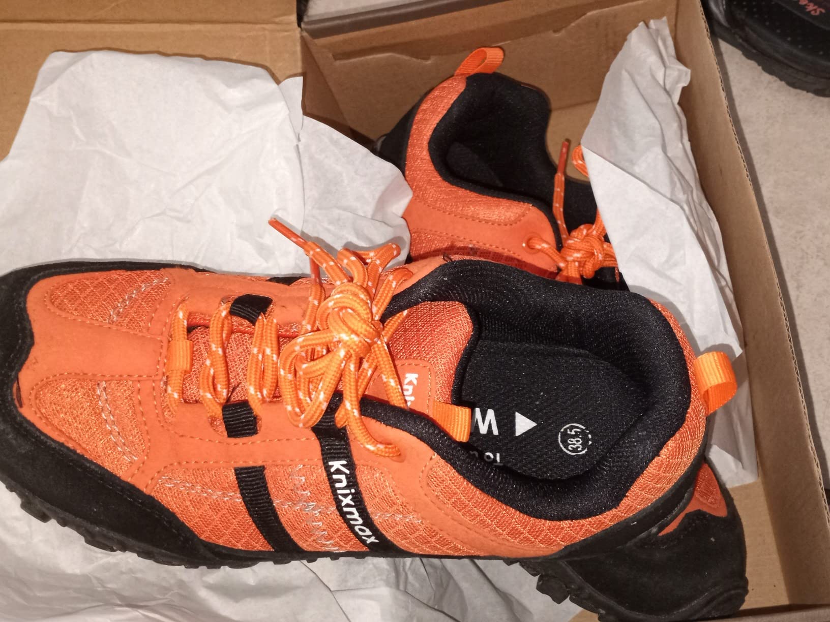 Knixmax product packaging showing included extra insoles and laces