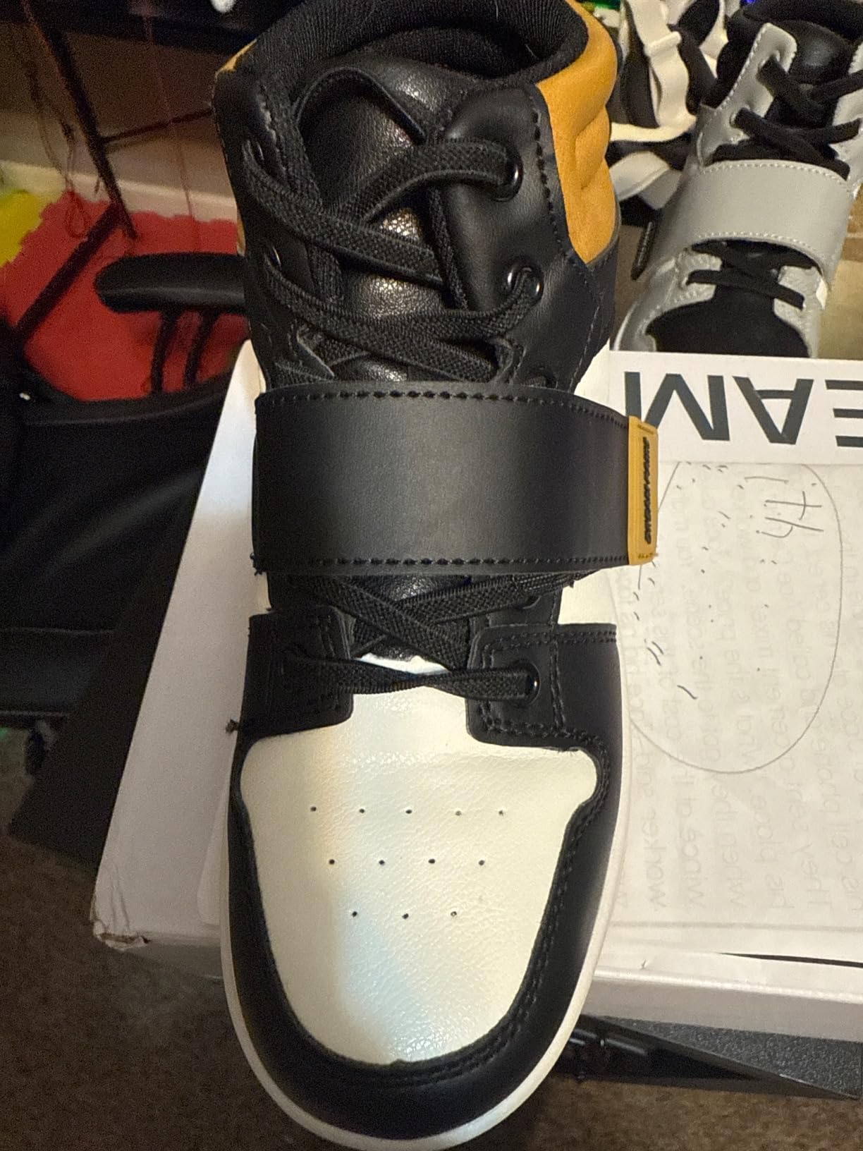 DREAM PAIRS basketball shoes detail showing hook and loop closure system and padded collar