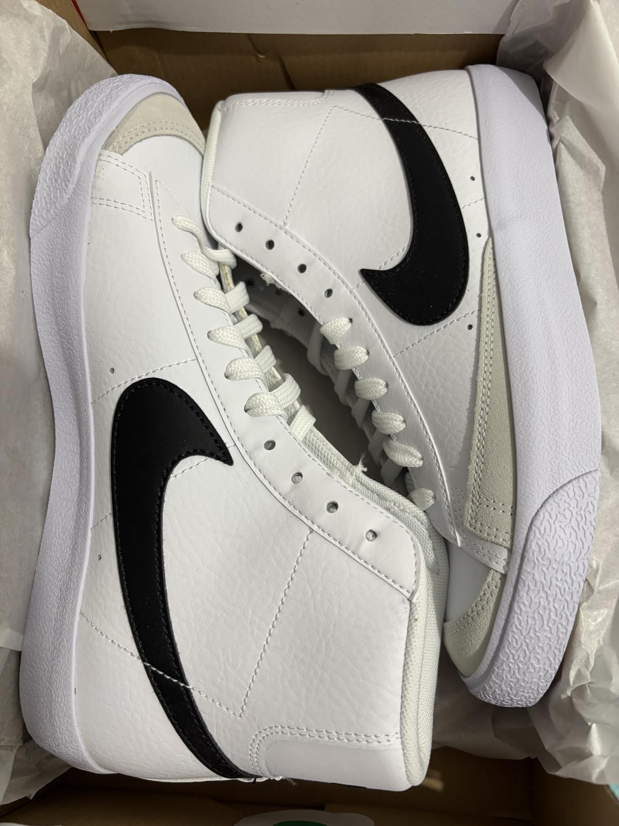 Action shot of Nike Kids Blazer Mid 77 during playground activities showing durability and performance