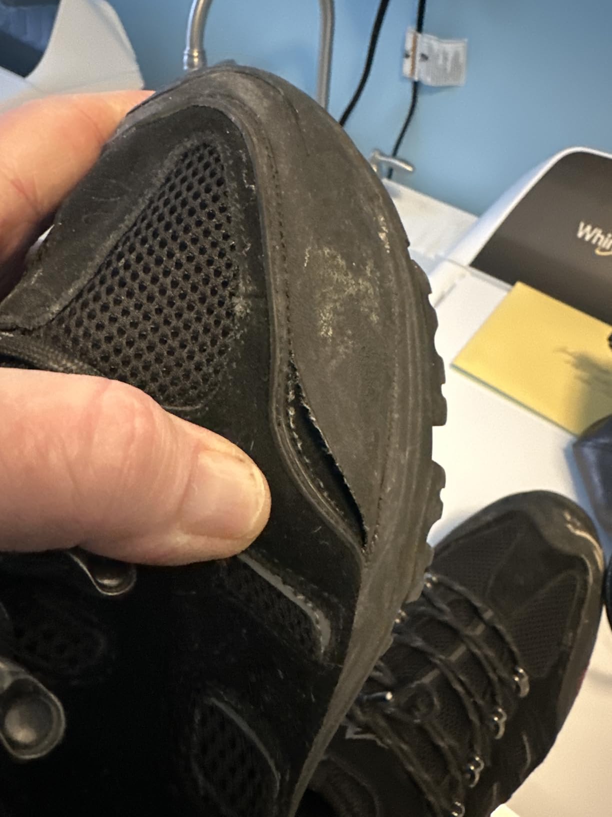 Side profile showing NORTIV 8 hiking shoe design with protective toe cap and ankle support structure
