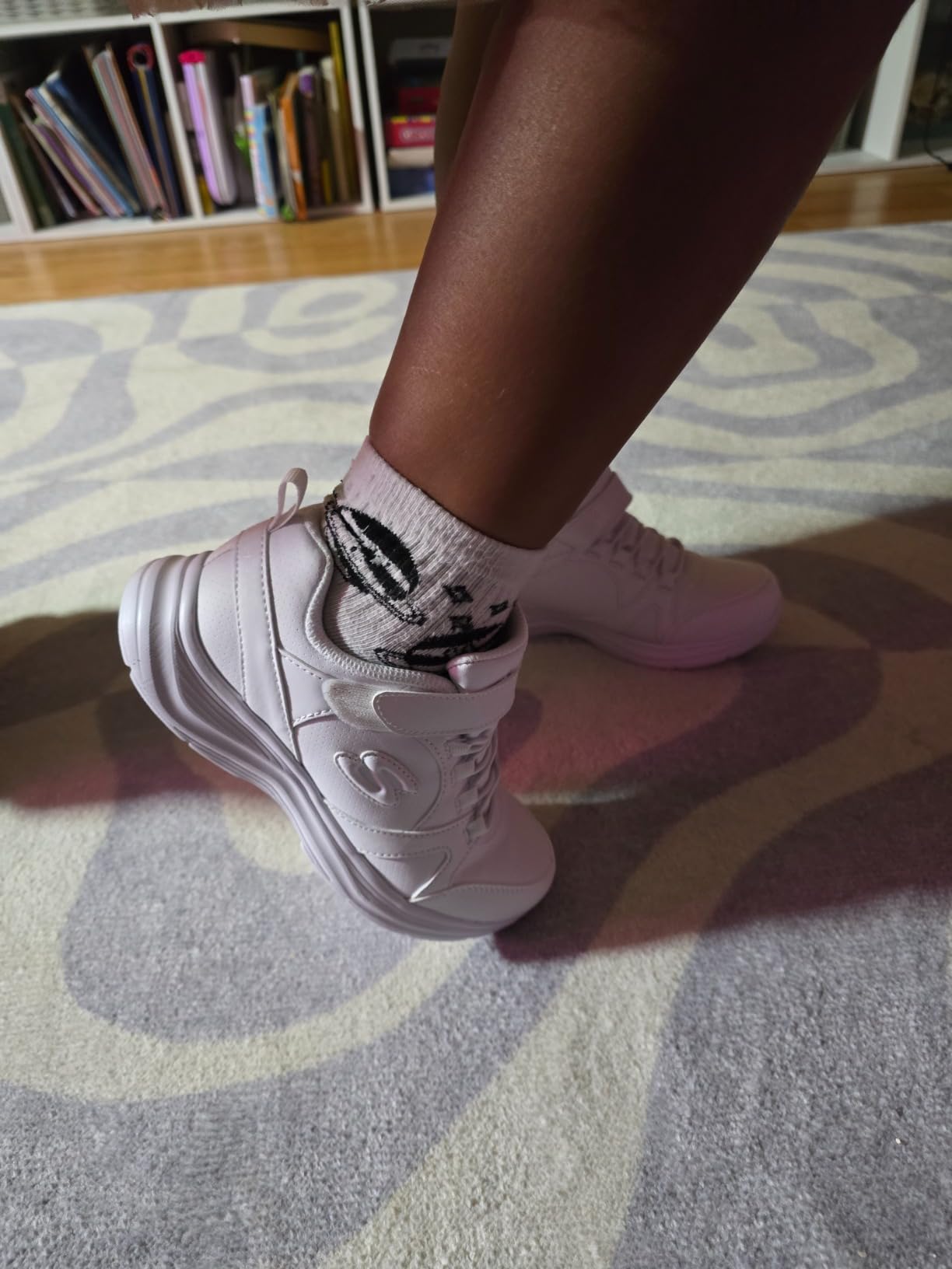 Close-up view of Skechers Girls Glimmer Kicks showing synthetic upper construction and velcro strap detail