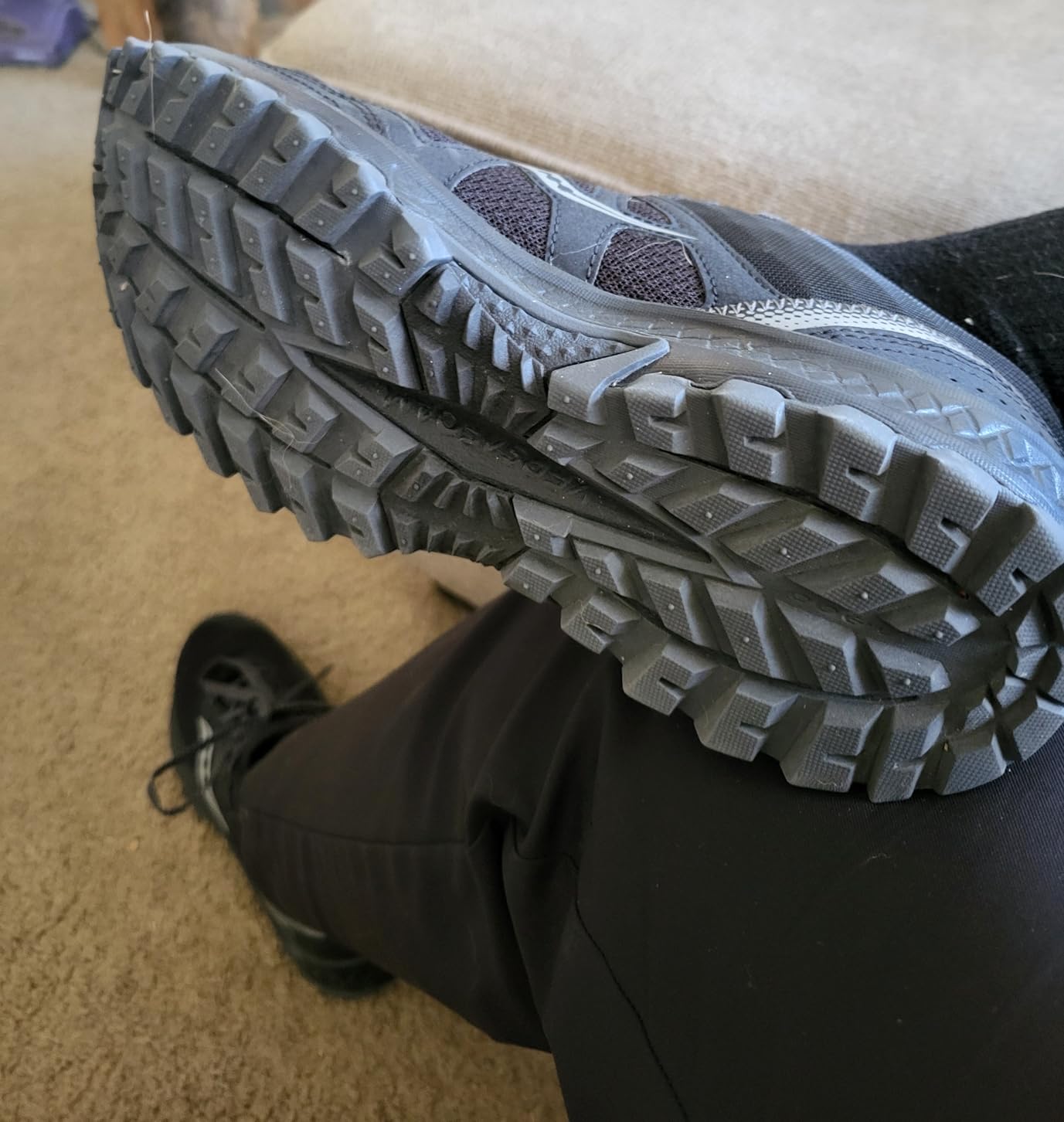 Trail testing photo showing shoes after 16k steps at theme park with solid tread wear