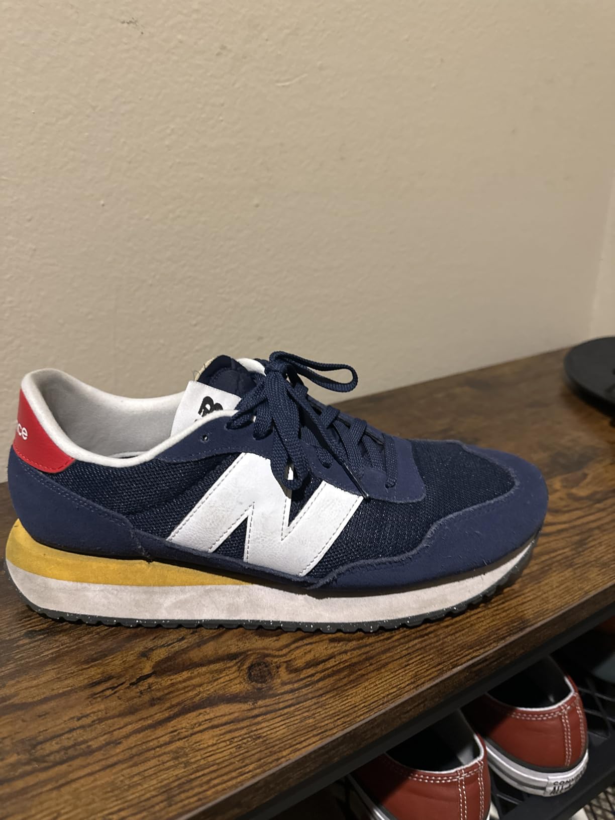 New Balance 237 V1 showing exposed foam tongue detail and suede mesh upper construction