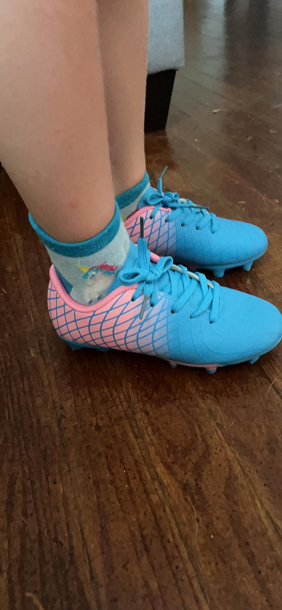 Close-up of JABASIC kids cleats lacing area showing lace length on small sizes