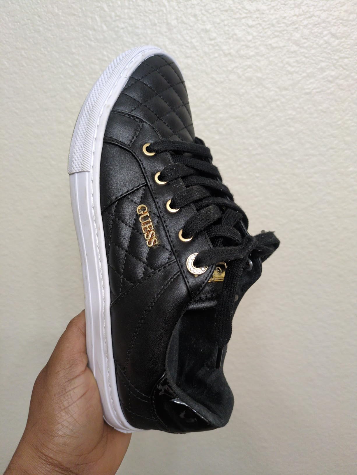 GUESS Women's Loven Sneaker close-up showing material quality and construction details