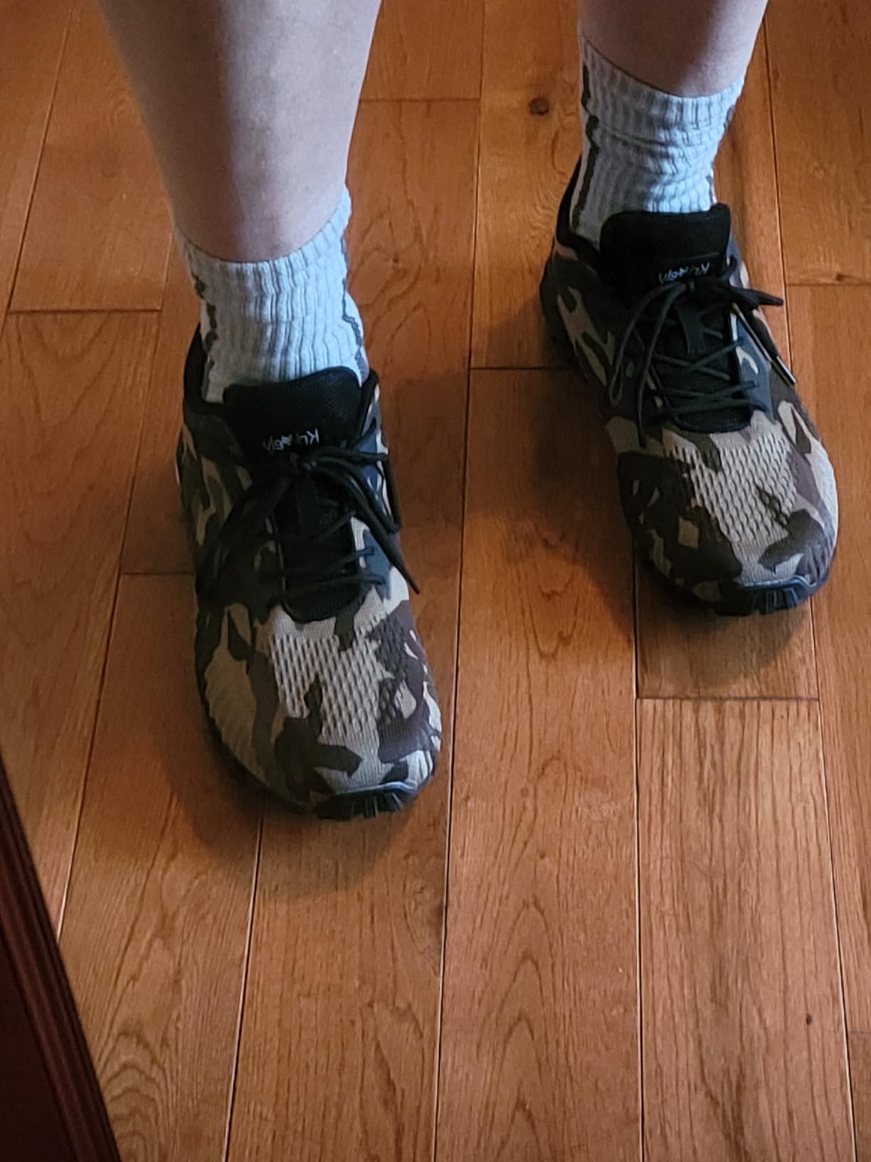 Muddy trail conditions showing Kricely shoe traction performance in challenging terrain