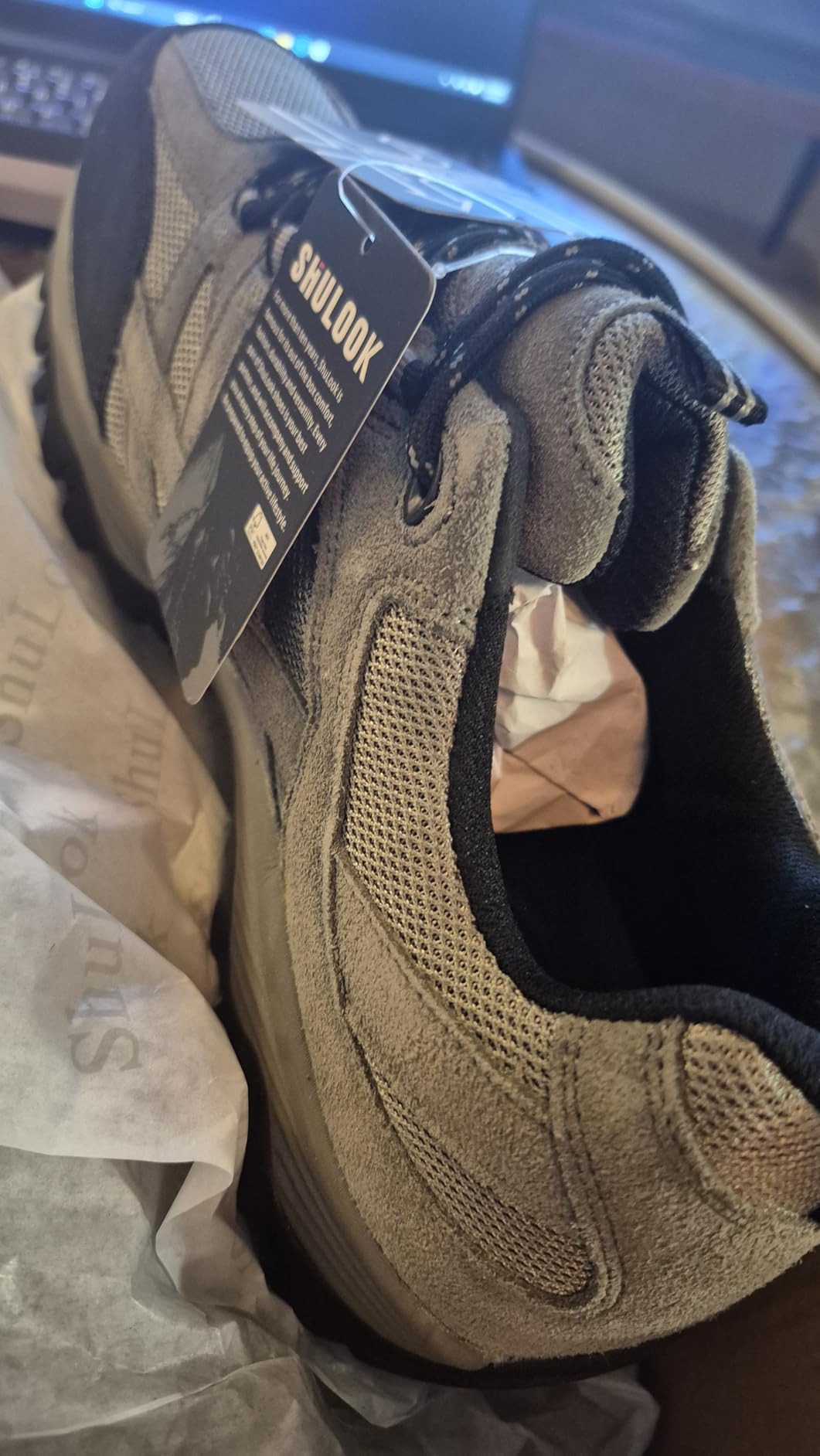SHULOOK hiking shoes being tested in wet grass and muddy conditions