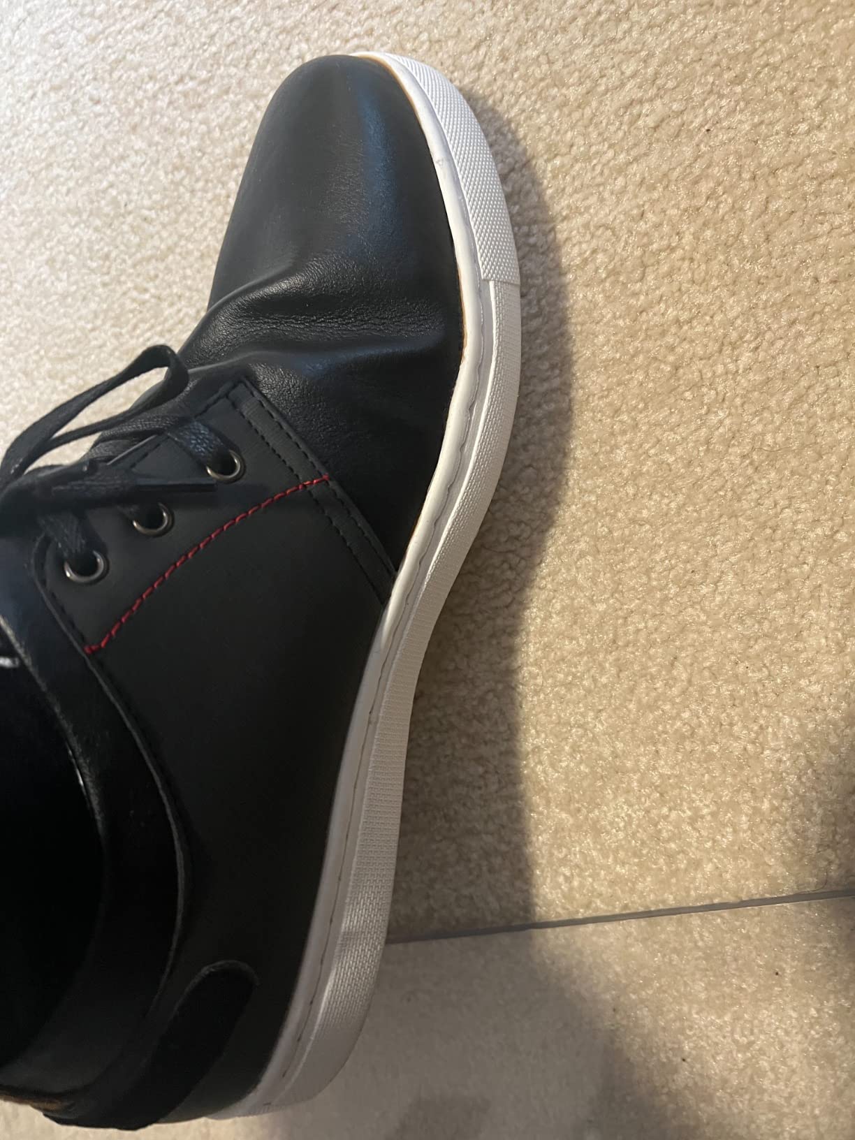 Close-up of Bruno Marc sneaker sole showing PVC outsole flex and construction details