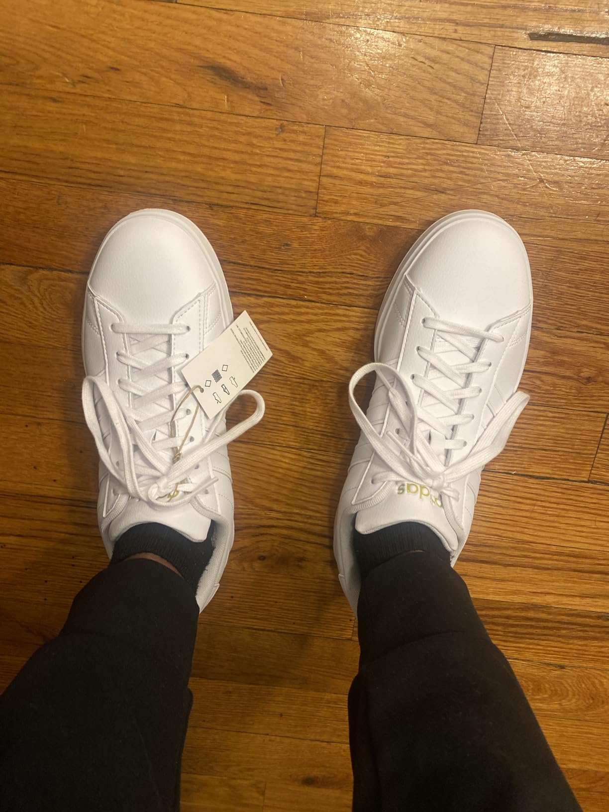 Side-by-side comparison showing Adidas Grand Court 2.0 construction details and branding elements