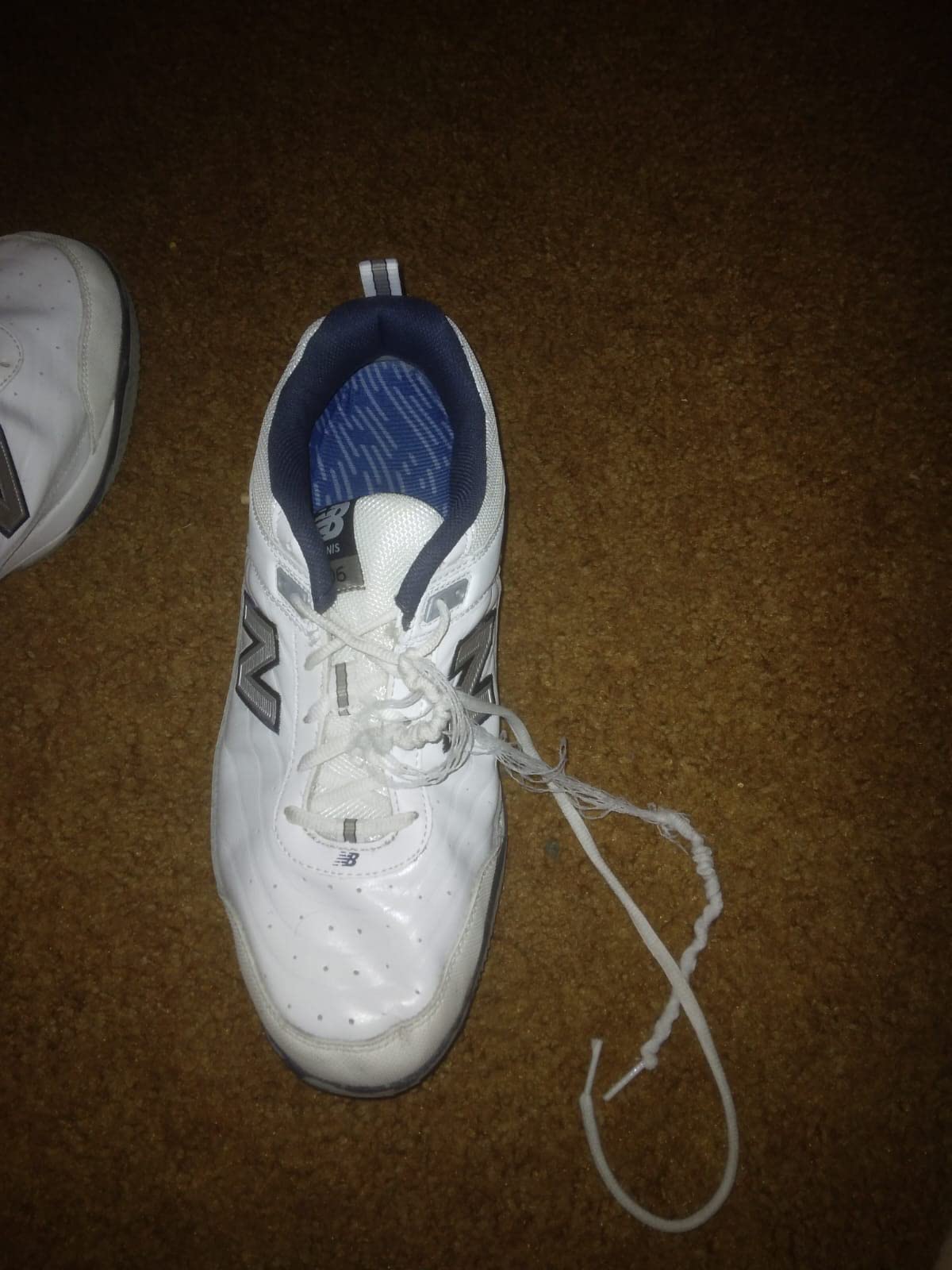 New Balance 806 tennis shoe action shot showing wear patterns and court performance