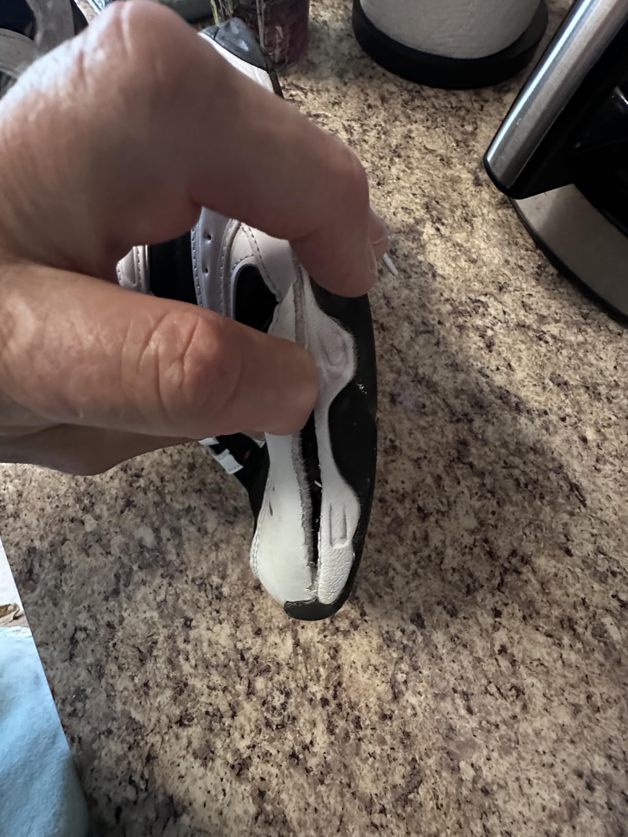 Avia shoe showing severe toe area damage and upper separation from sole