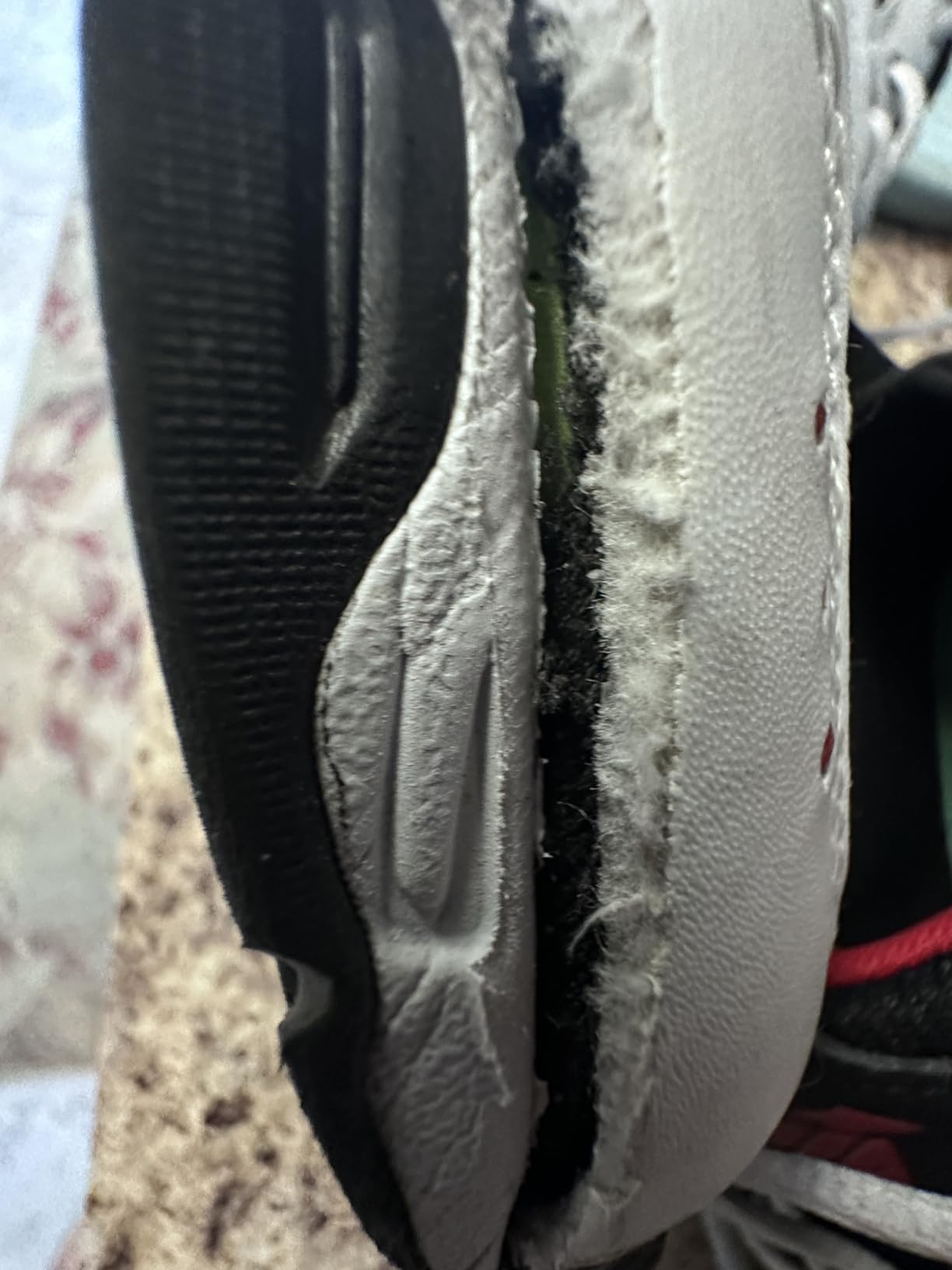 Damaged Avia sneaker showing structural failure at heel and side panels