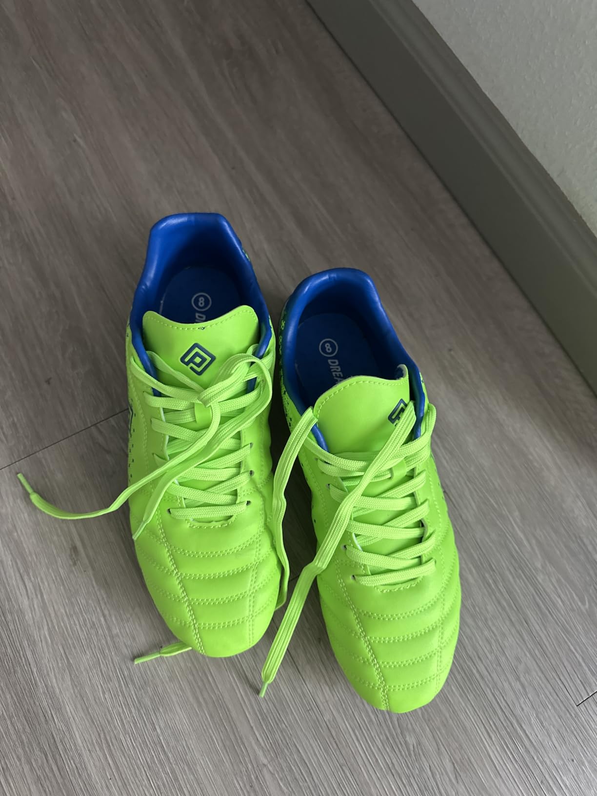 DREAM PAIRS men's soccer cleats neon green and royal blue colorway showing high ankle design