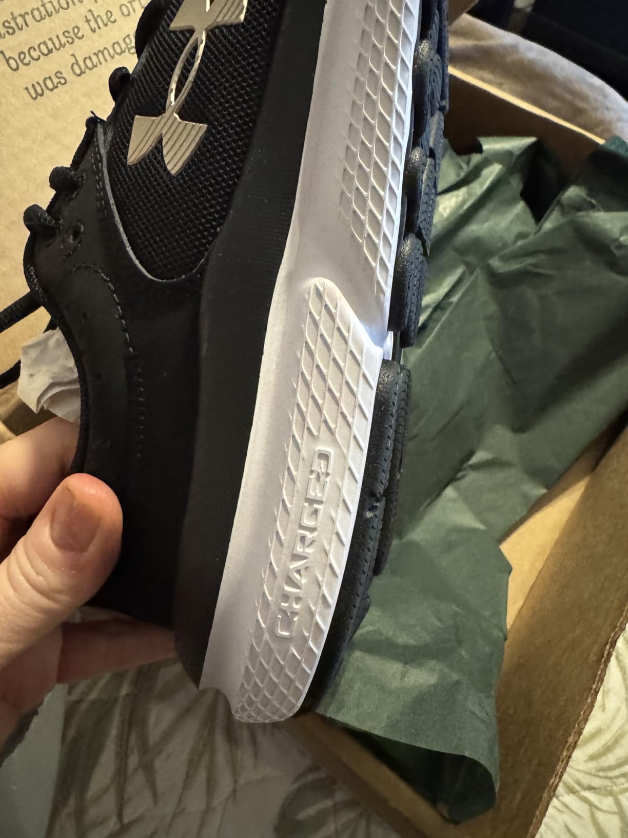 Under Armour Assert 10 upper mesh and overlay construction showing durability features