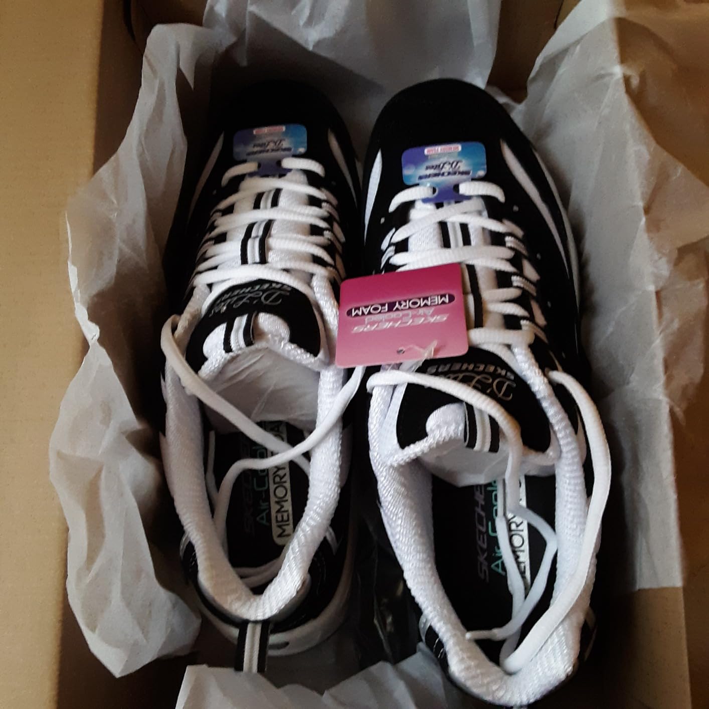 Skechers D'Lites showing stylish details including small rhinestone accents and quality lacing system
