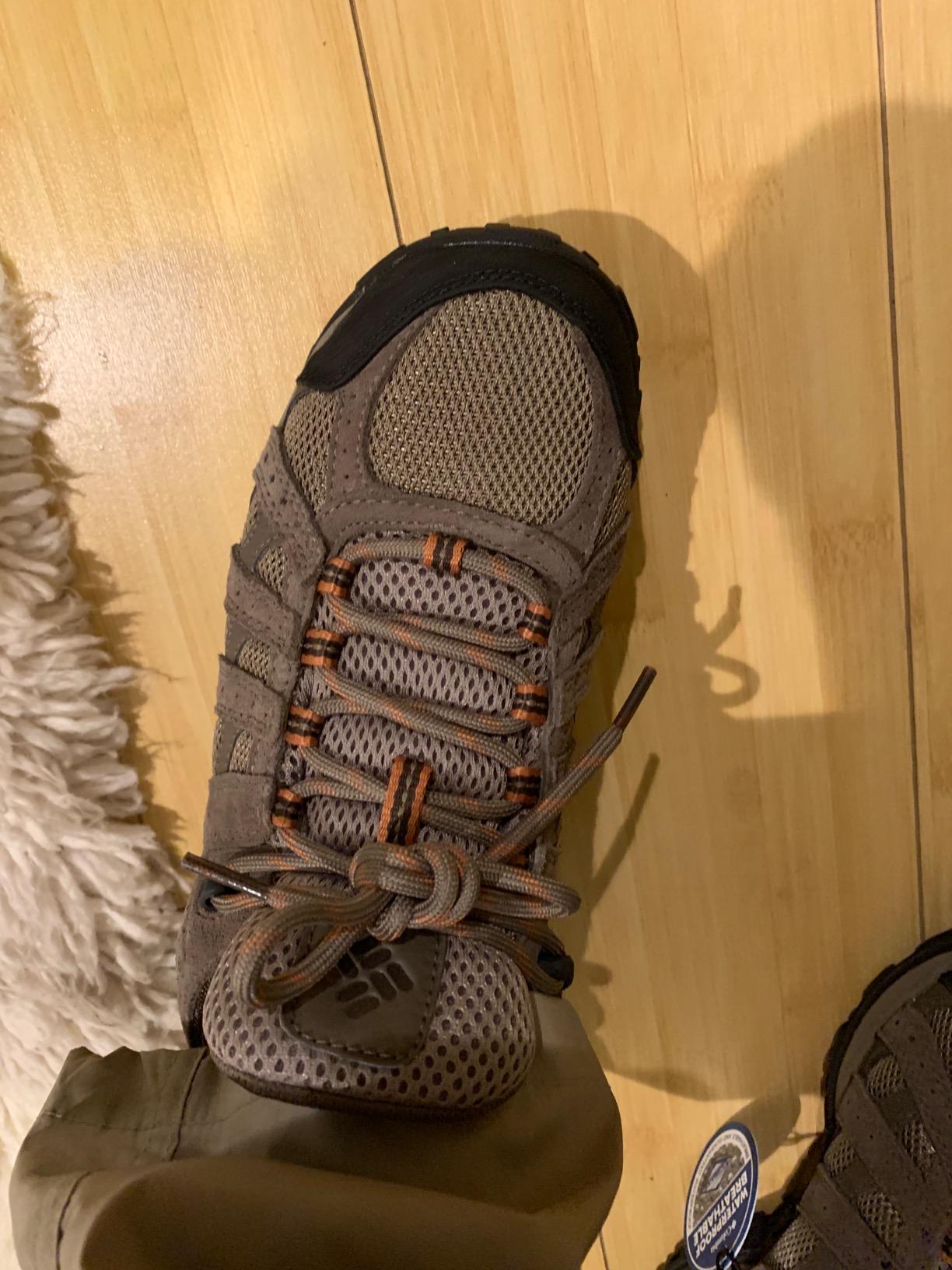 Action shot of Columbia Redmond hiking shoes on trail showing real-world performance and traction