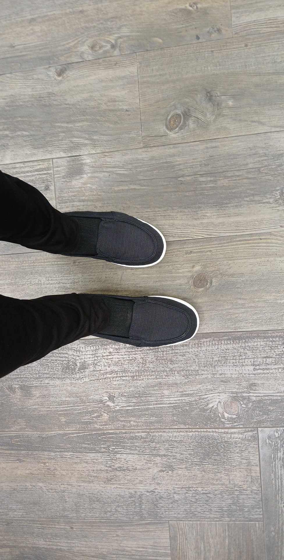 Action shot of Roxy Minnow slip-ons during daily walking showing comfort in motion
