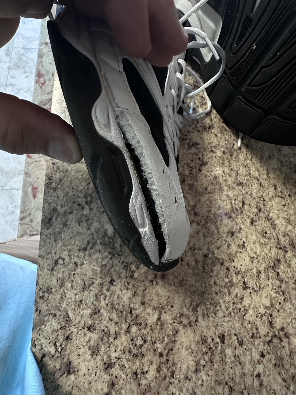 Multiple Avia shoes showing various failure points including sole separation and upper damage