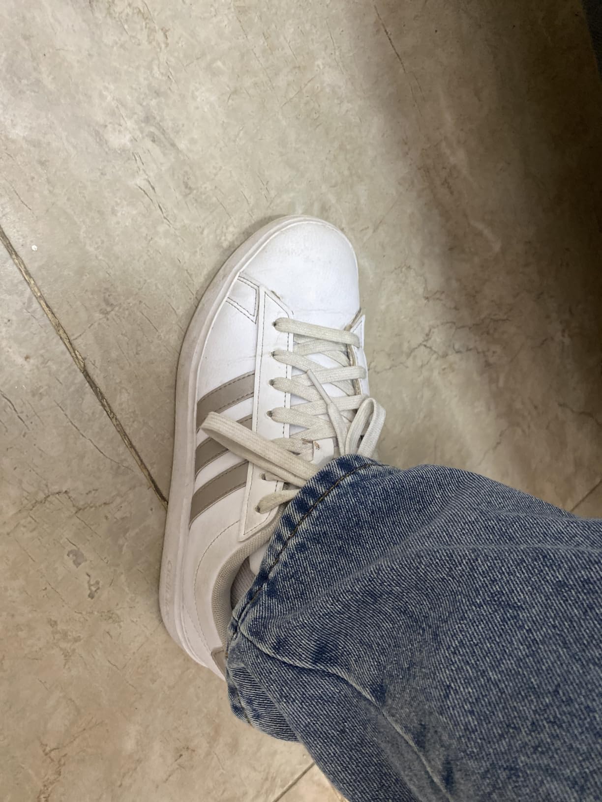 Adidas Grand Court 2.0 worn in real-world setting showing versatile styling capability