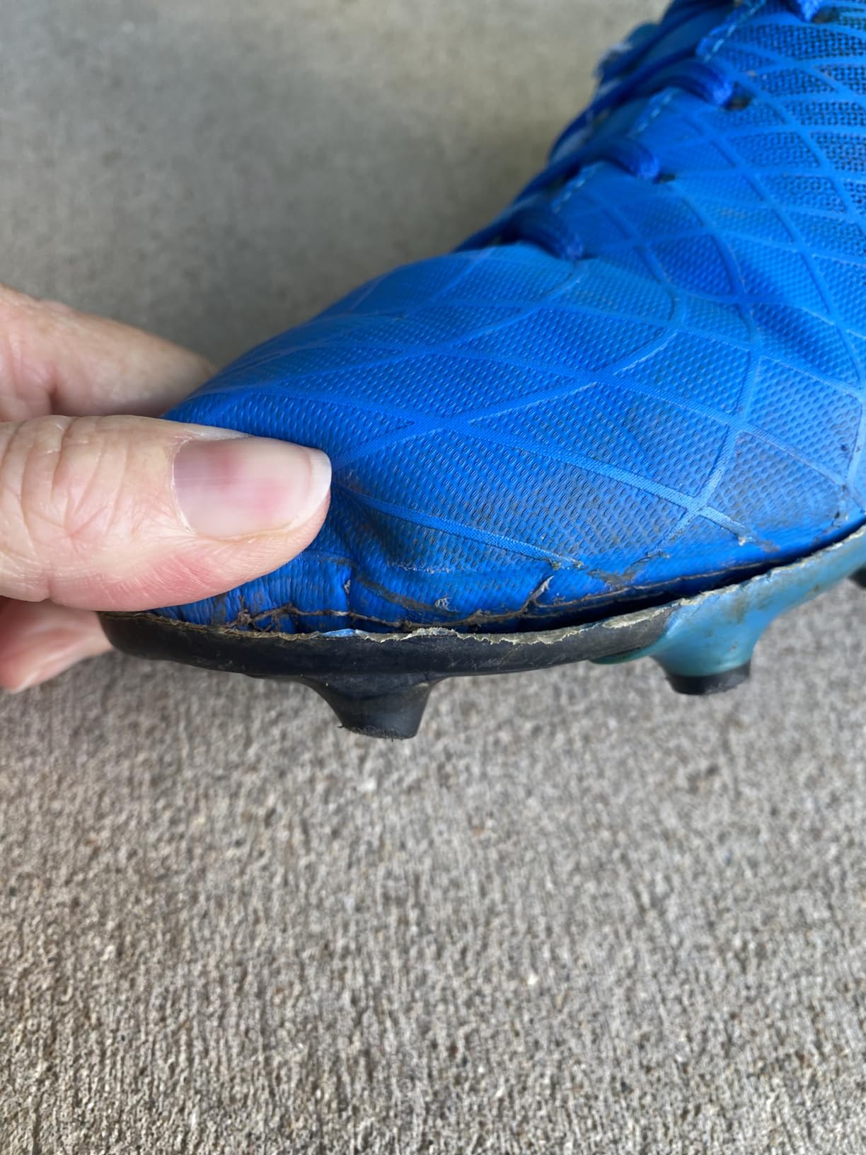 Customer photo highlighting outsole peeling and wear after a short period