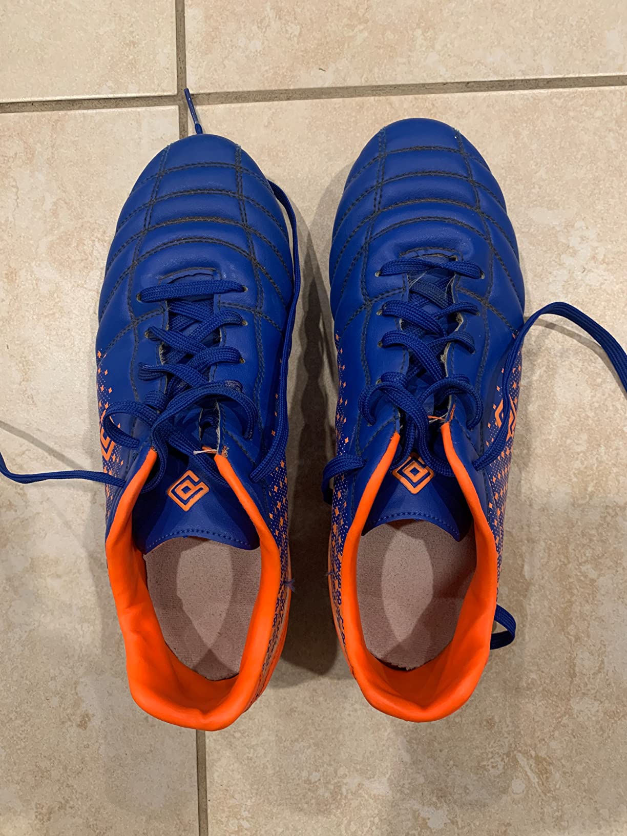 DREAM PAIRS soccer cleats showing extra foam padding in upper for ball striking protection