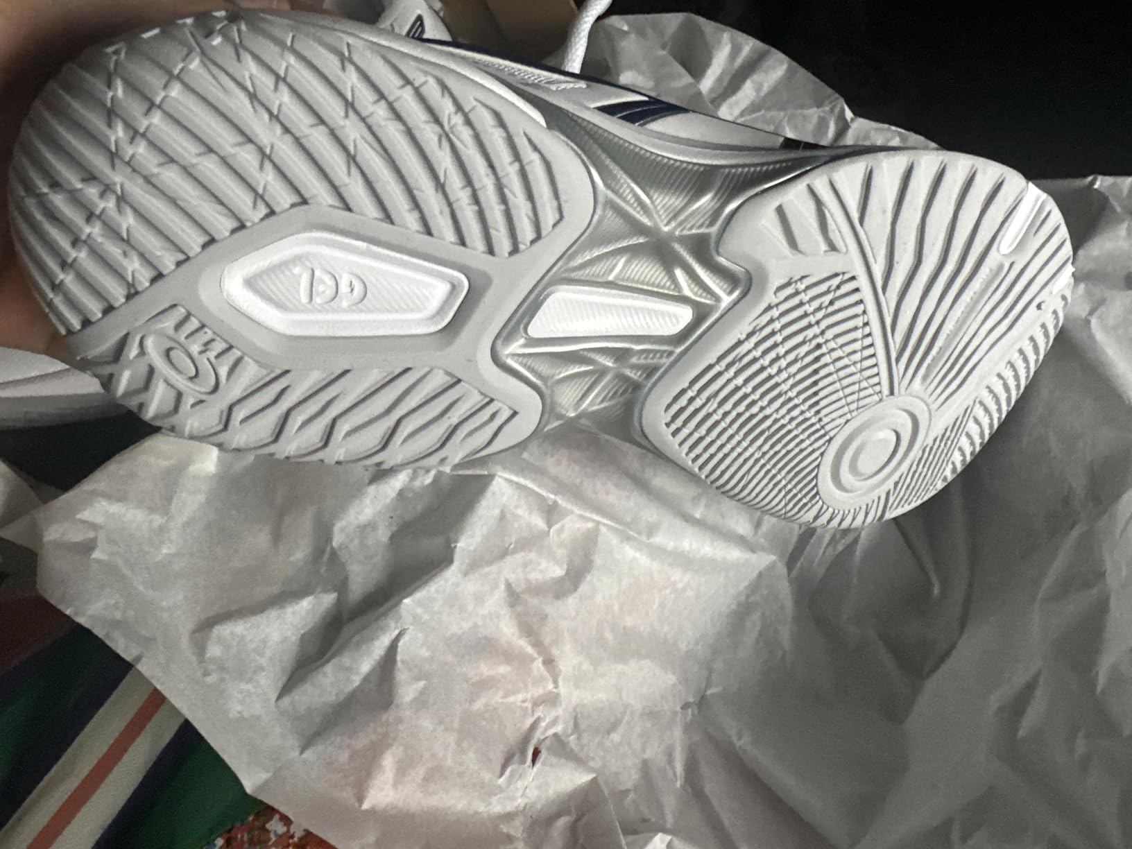 ASICS Gel-Rocket 10 outsole showing flex grooves and gum rubber pattern for court traction
