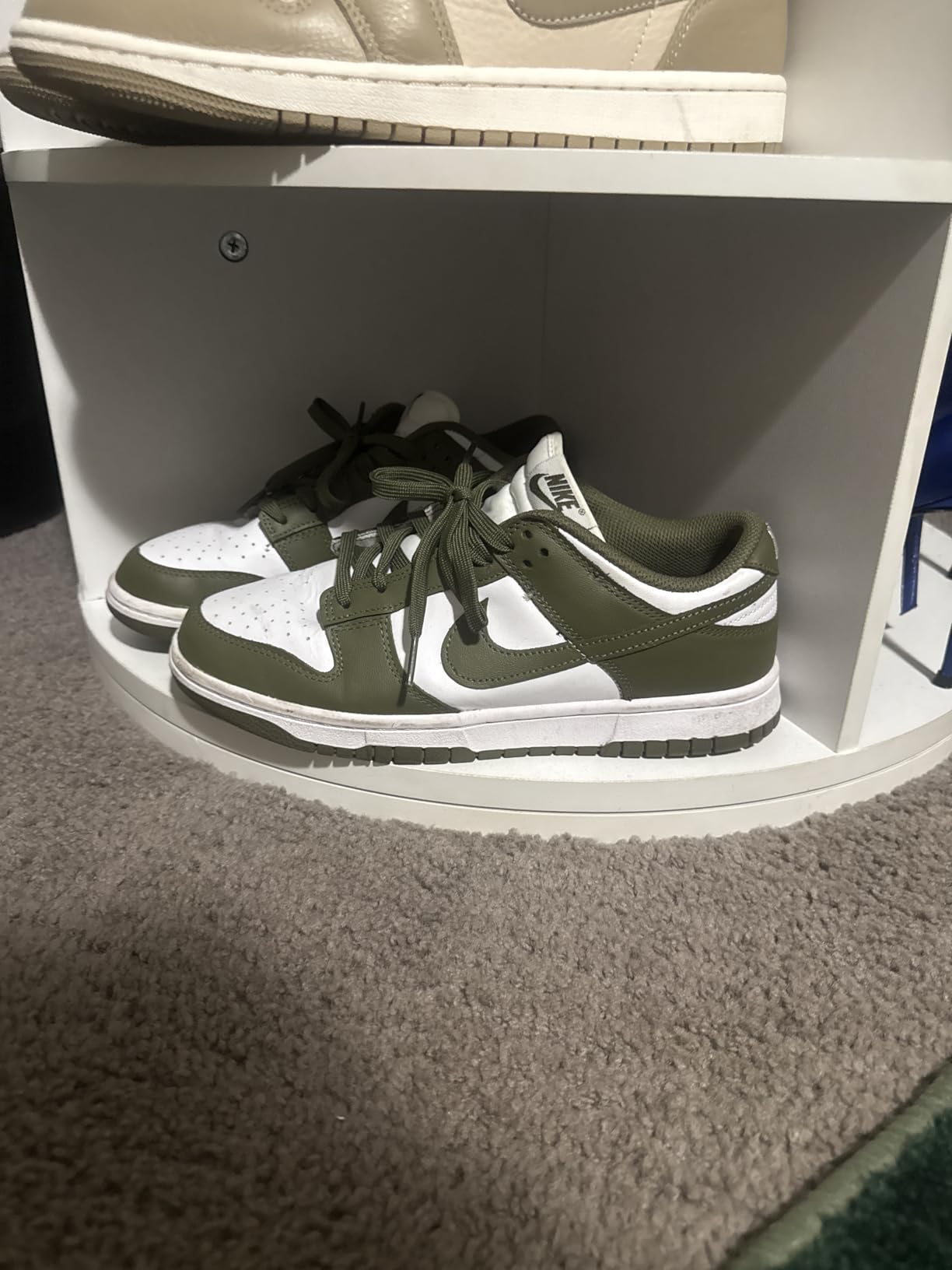 Nike Women Dunk Low sneakers in Sail Cacao Wow Coconut Milk colorway showing classic low-top silhouette