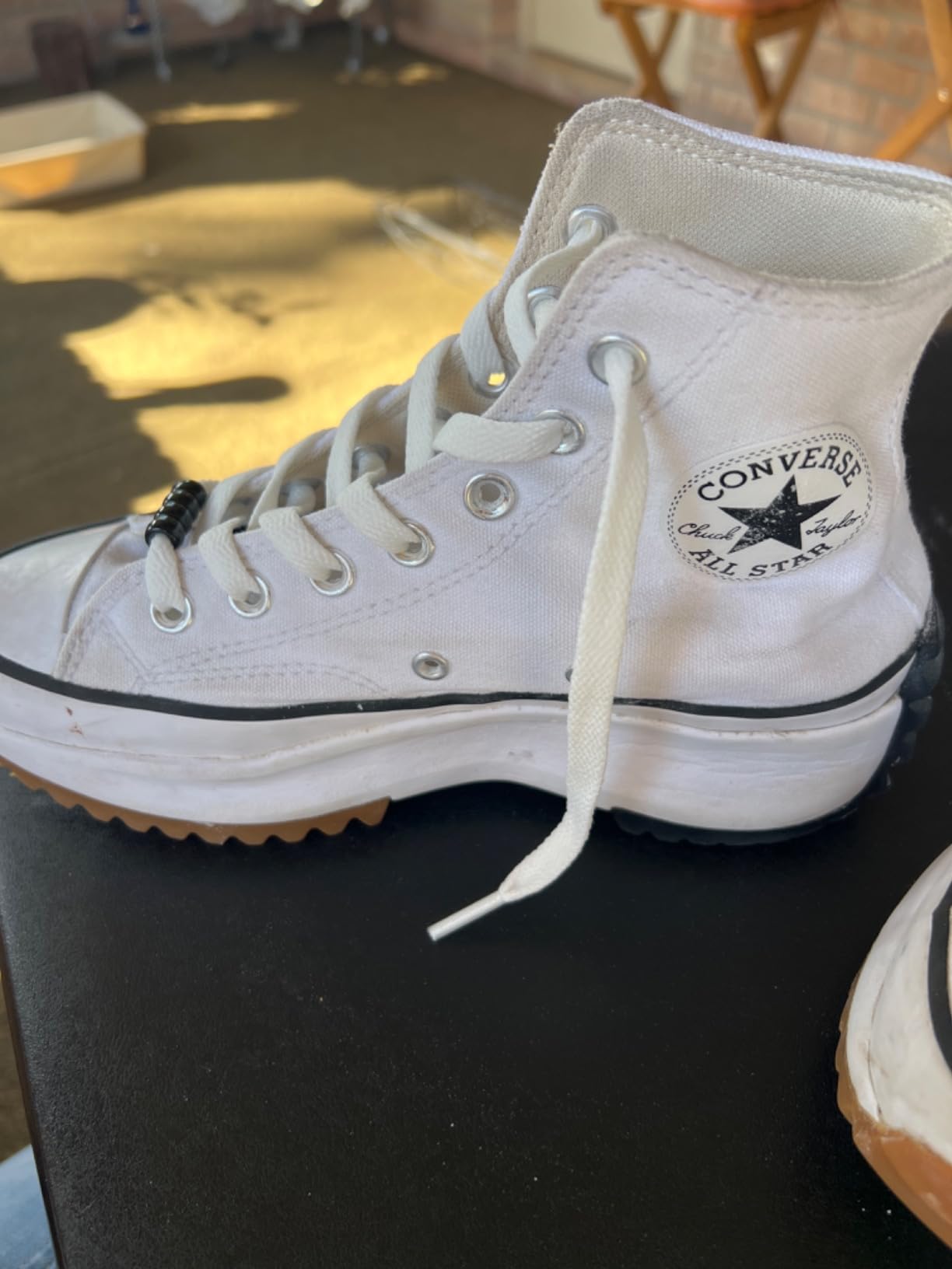 ZHENTOR shoelaces installed on white sneakers showing proper length and fit
