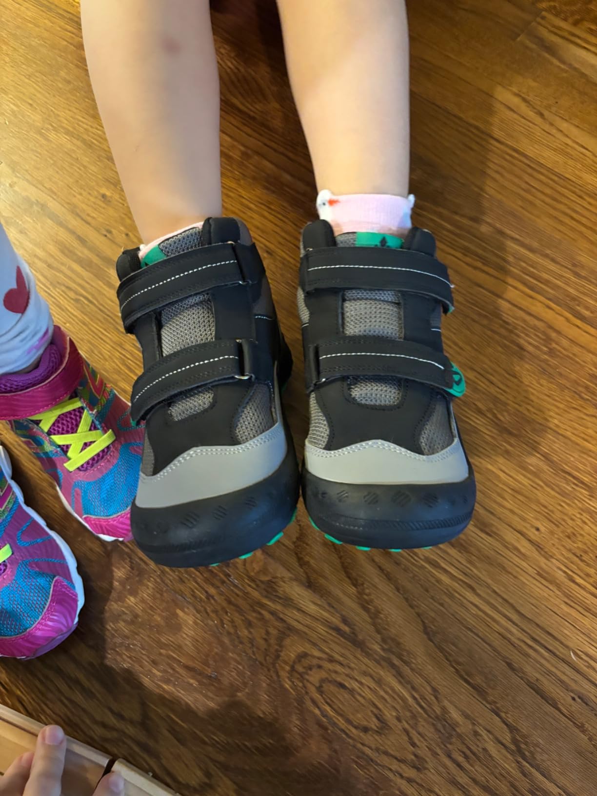 Real-world testing results of Mishansha kids hiking boots showing performance on different outdoor surfaces