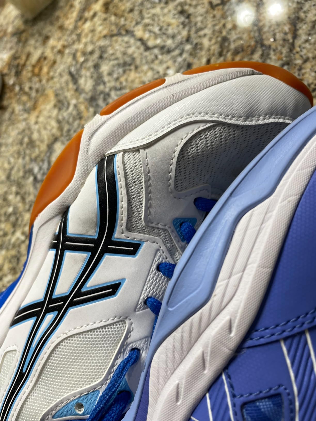 Asics Gel-RENMA pickleball shoes showing wrap-up outsole design for court stability