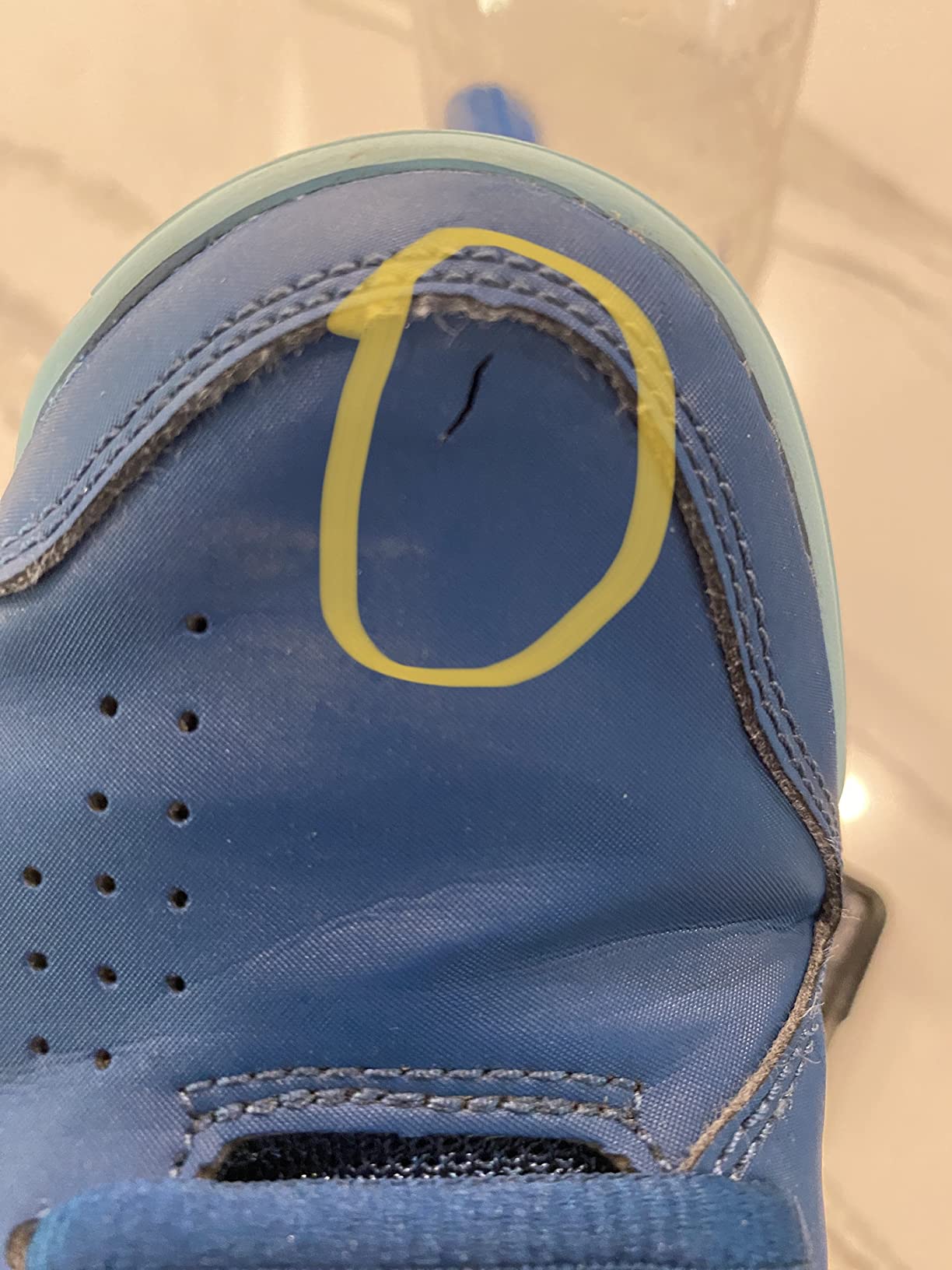Close-up of ASICS Gel-Dedicate 7 toe area showing wear and durability concerns after court use
