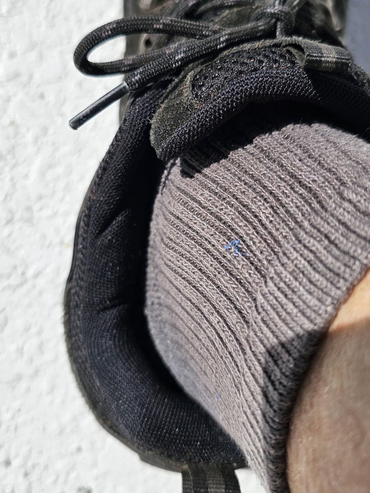 NORTIV 8 hiking shoes after brush clearing showing debris protection and durability challenges