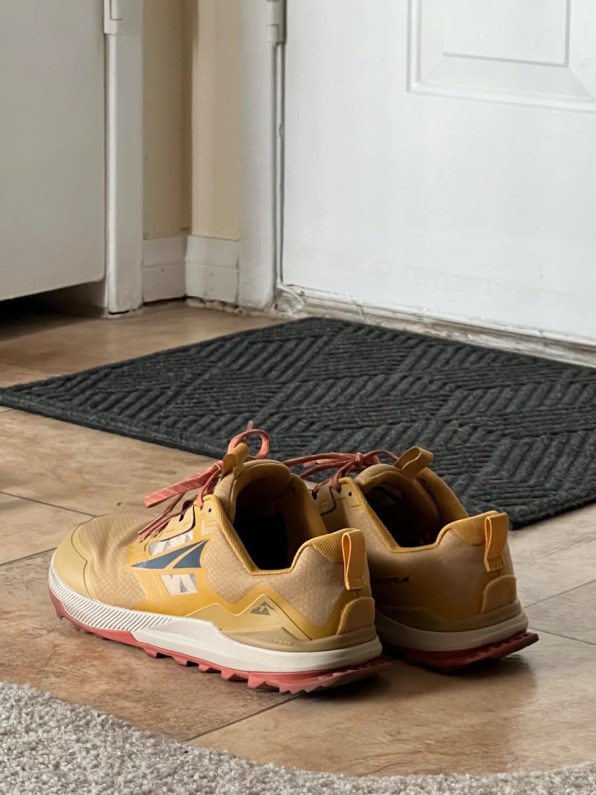 Side profile view of Altra Lone Peak 7 showing zero drop platform and midsole construction