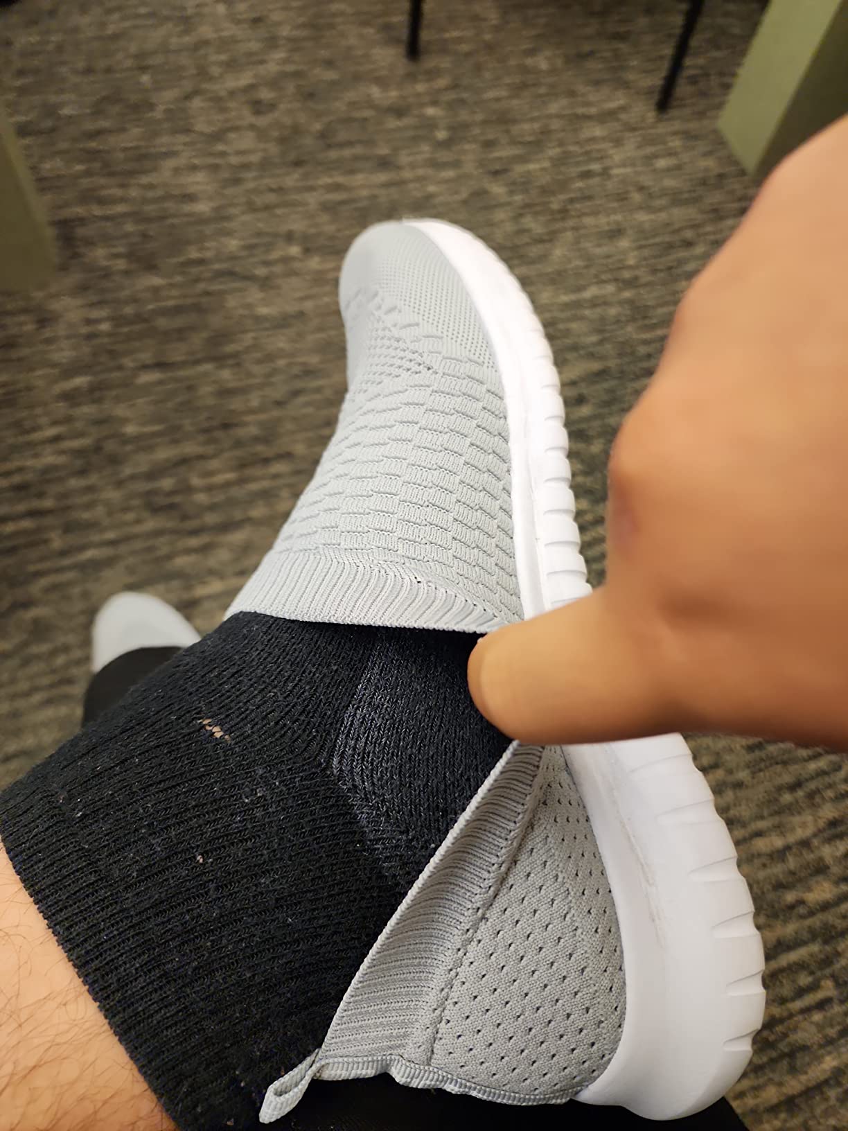 TIOSEBON walking shoes side view showing knit mesh upper texture and rubber sole construction