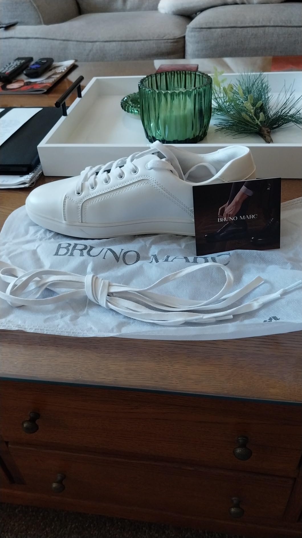 Bruno Marc sneakers in cloth storage bags showing premium packaging and extra laces included