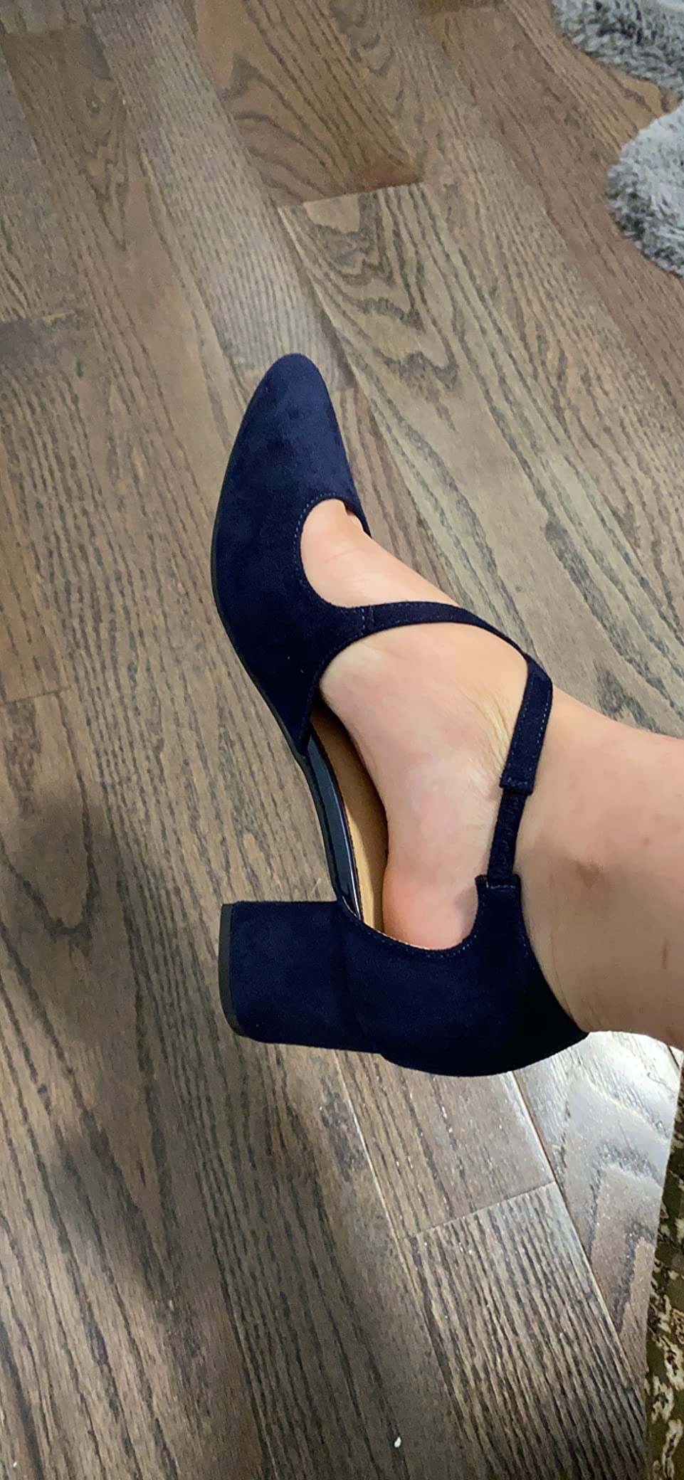 Close-up of IDIFU Lynn pumps cross strap buckle detail and ankle support system