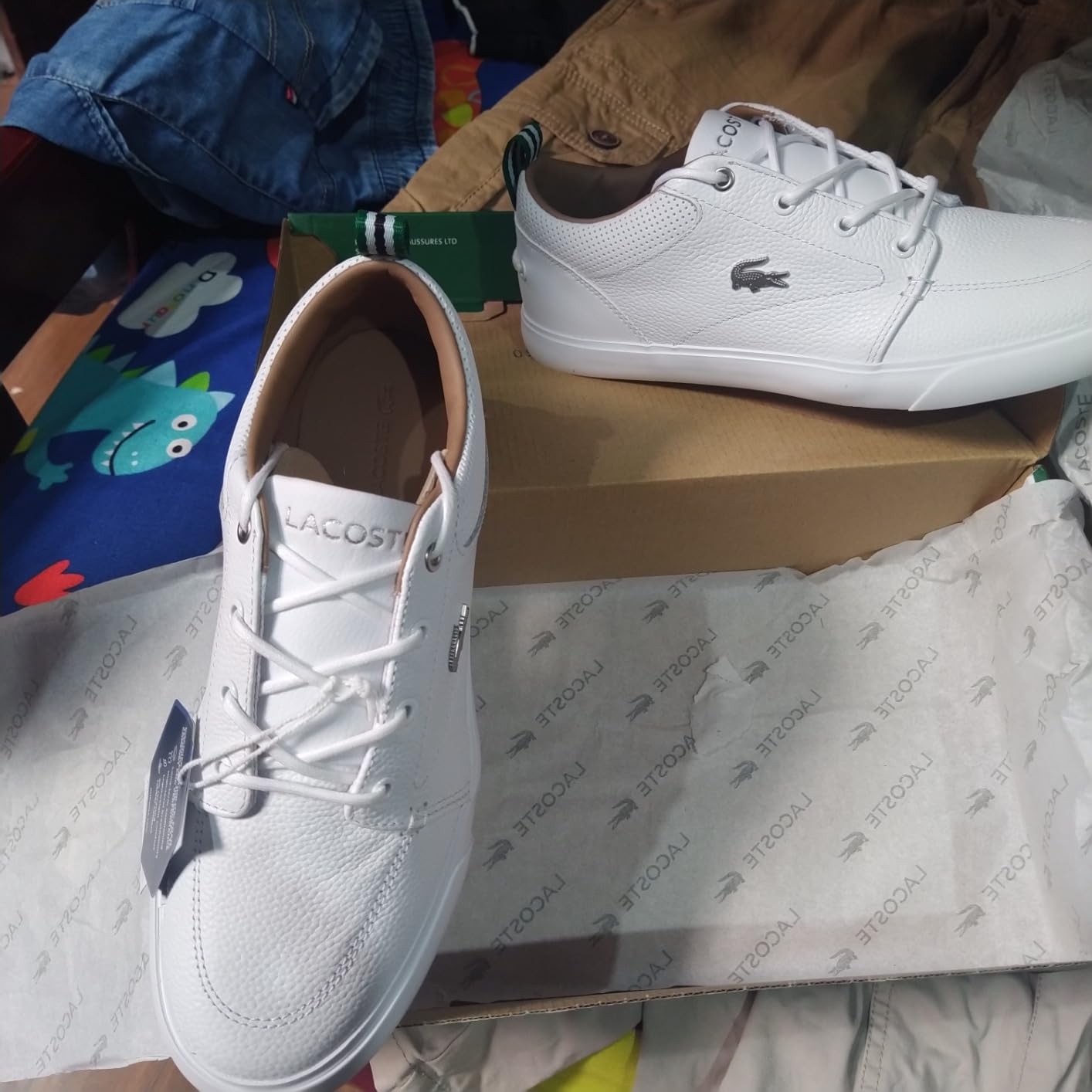 Lacoste Bayliss sneaker side profile showing leather and suede construction with crocodile branding detail