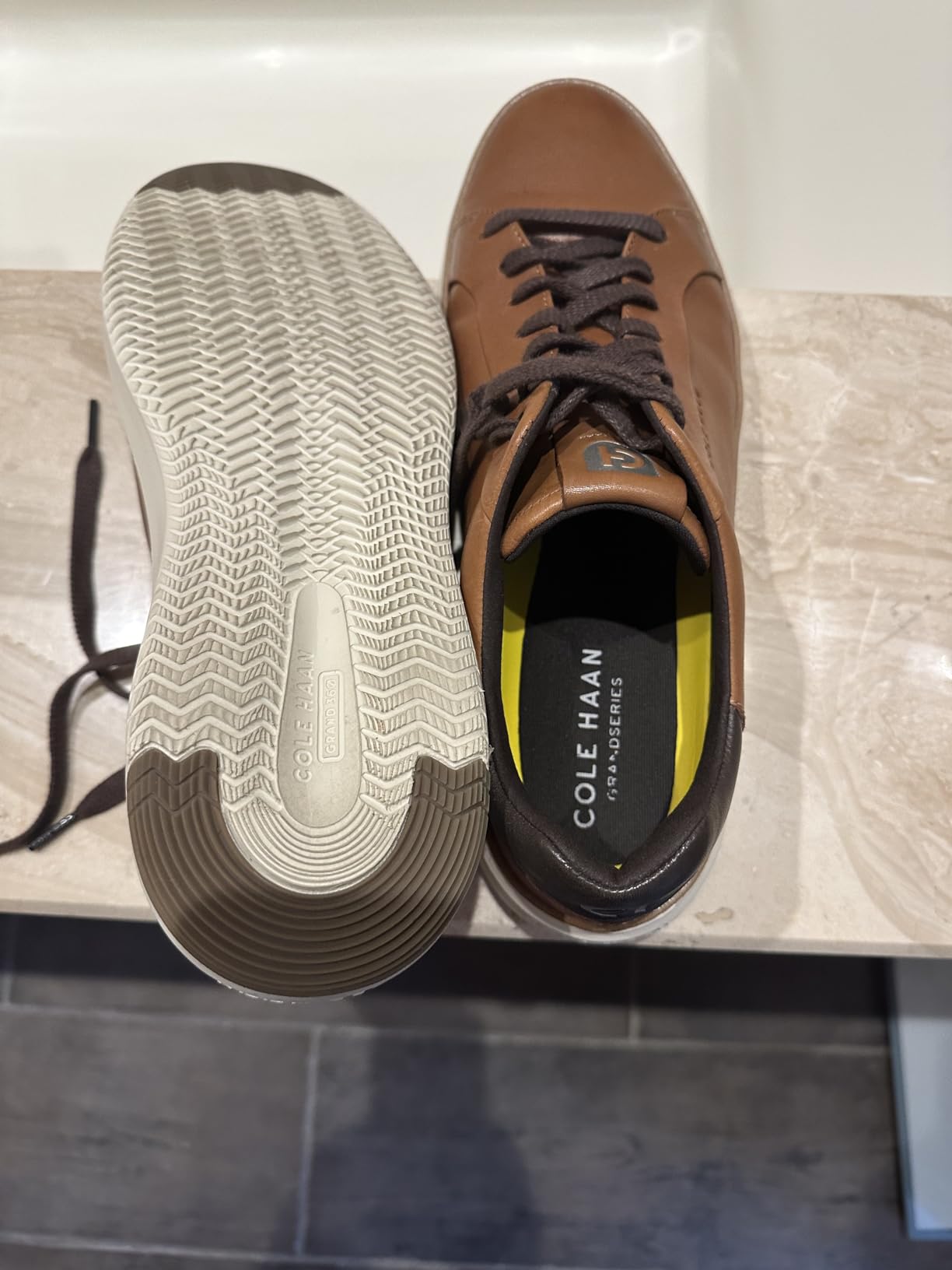 Cole Haan Grandpro Topspin lifestyle shot showing versatile wear from golf to casual business attire