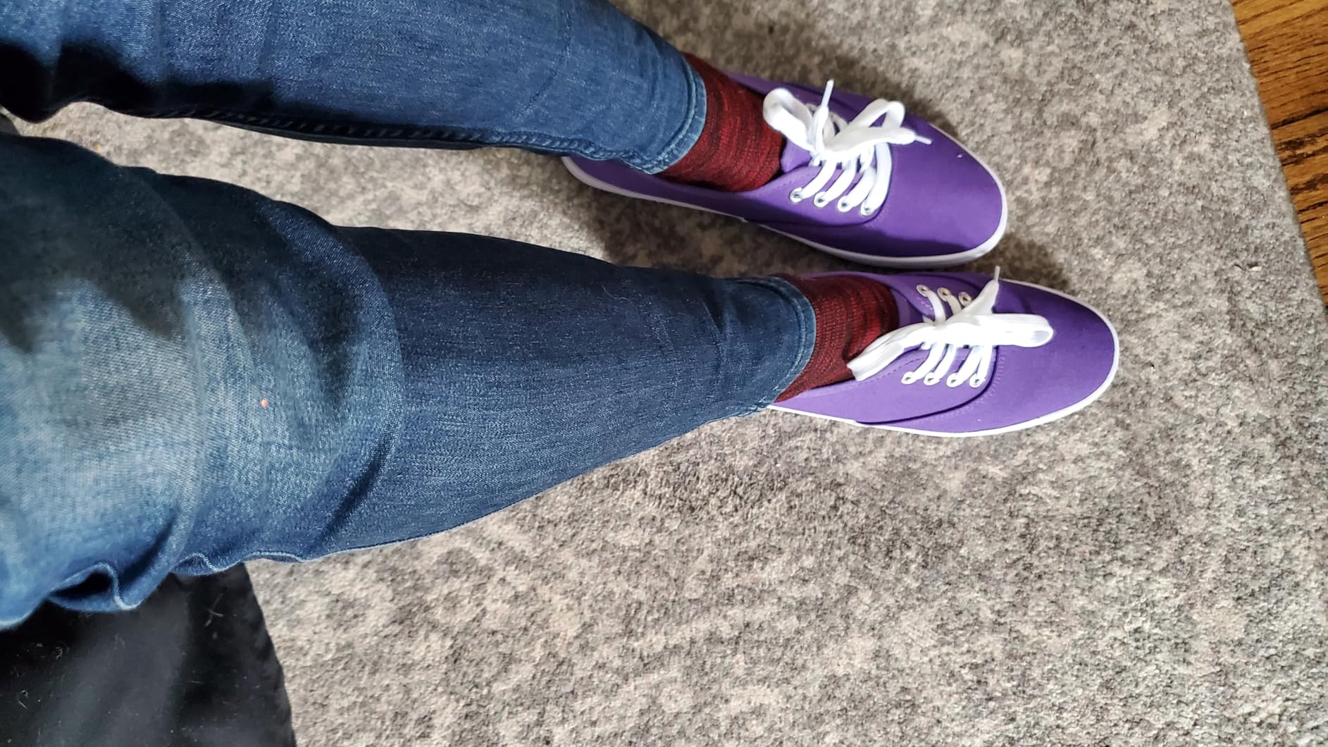 Close-up of TUOPIN sneaker showing canvas upper texture and metal eyelets