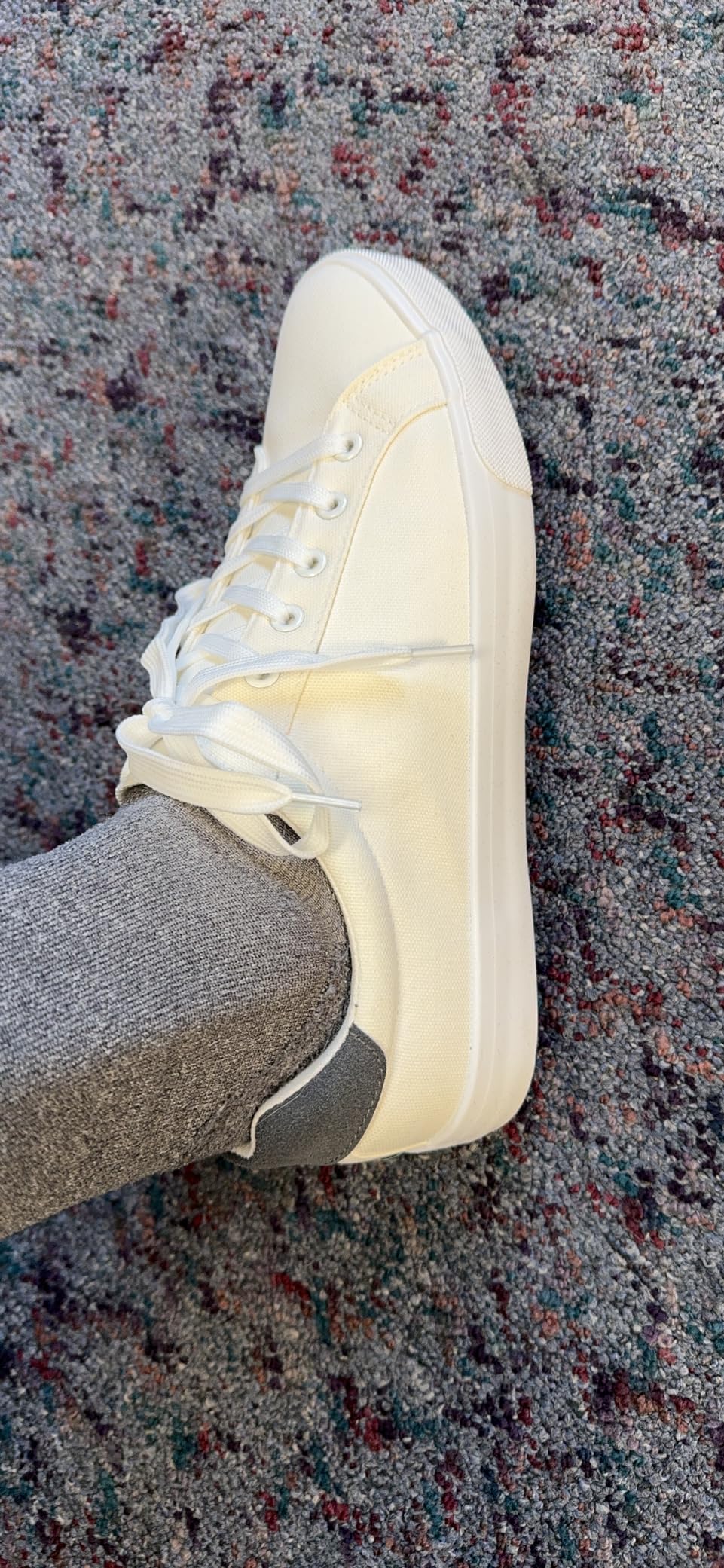 FRACORA white canvas shoes styled with casual jeans showing versatile appearance
