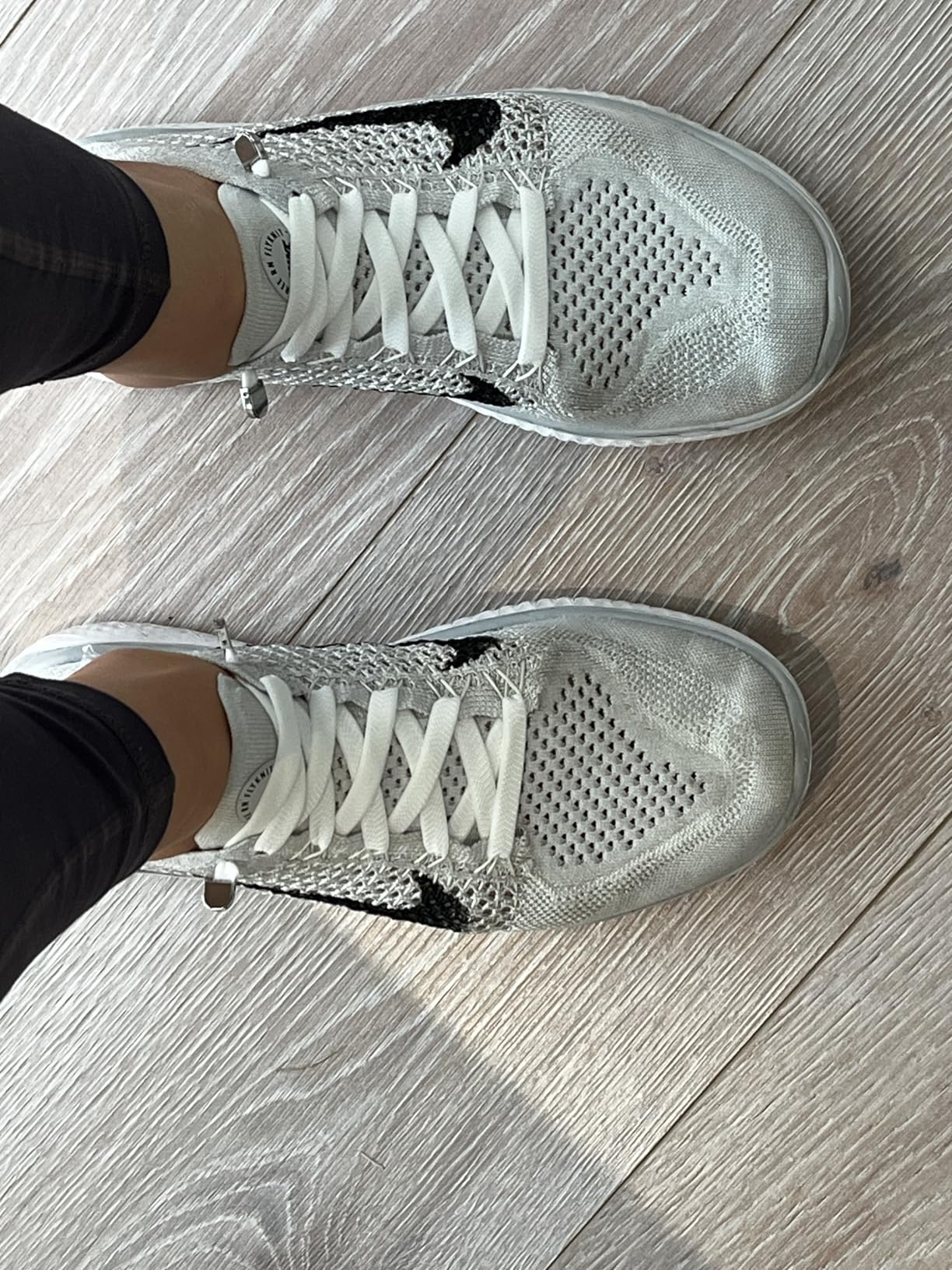 Final assessment showing Hstgaga elastic shoelaces installed on various family shoes