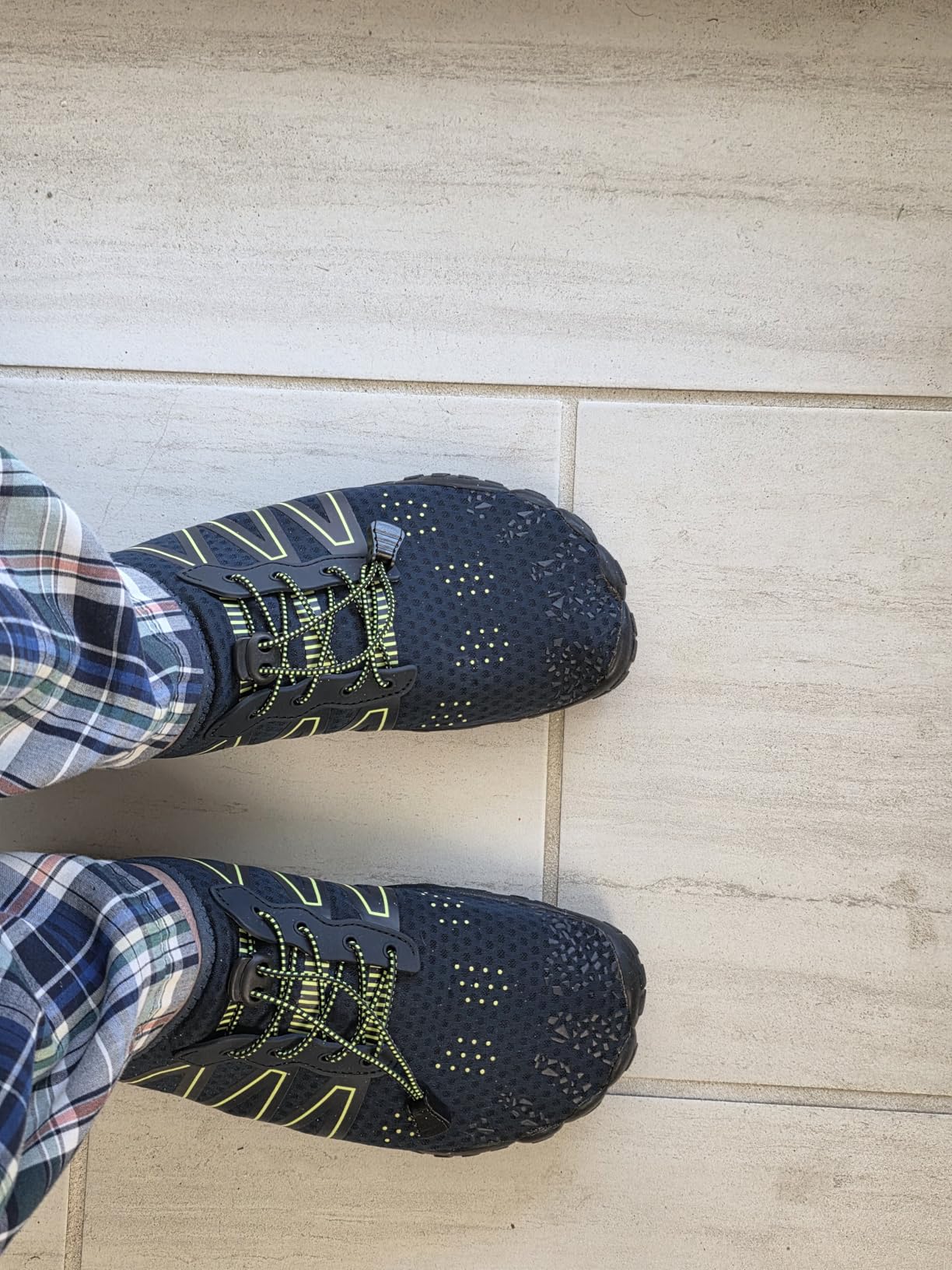 Close-up of water shoes showing Lycra mesh upper construction and pull-on design details