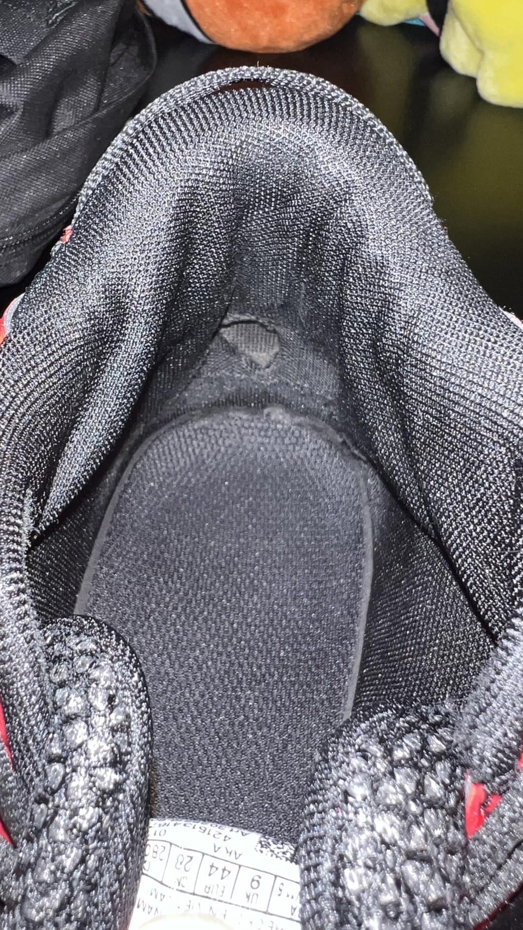 Under Armour Lockdown 6 side profile showing leather upper construction and herringbone outsole pattern
