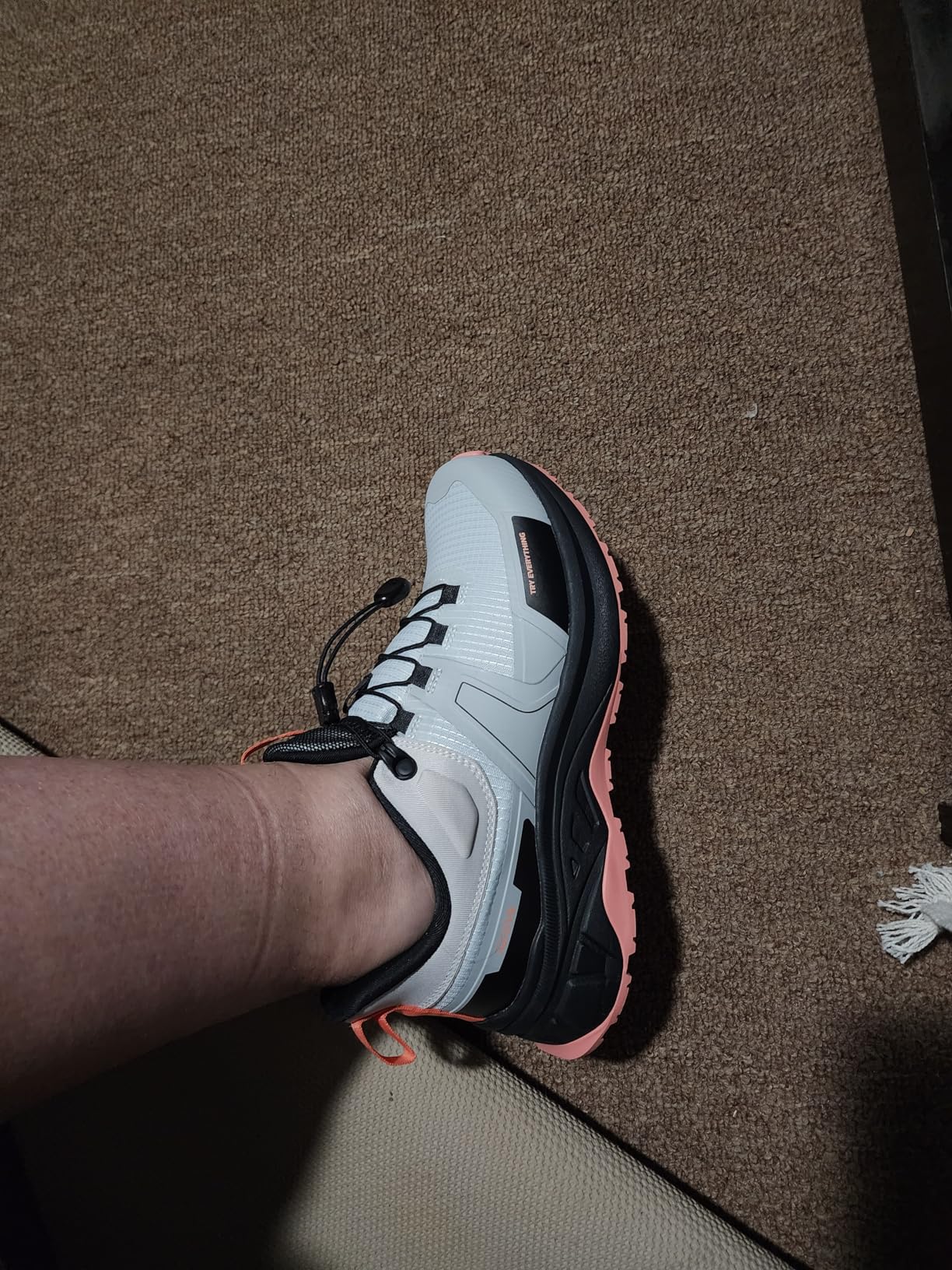Action shot of NORTIV 8 hiking shoes on rocky trail terrain showing real-world performance