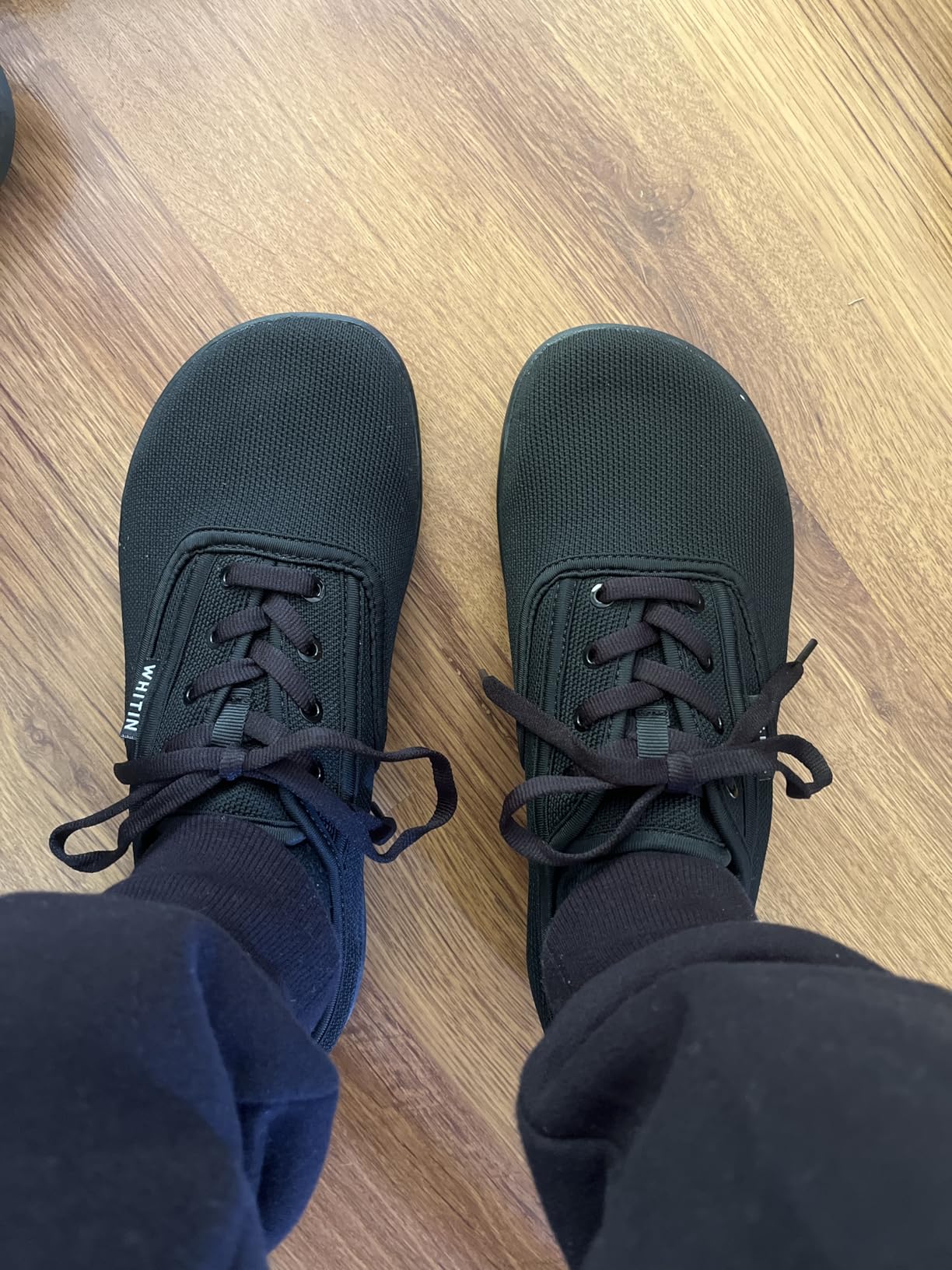 WHITIN canvas sneaker construction detail showing lacing system and upper materials
